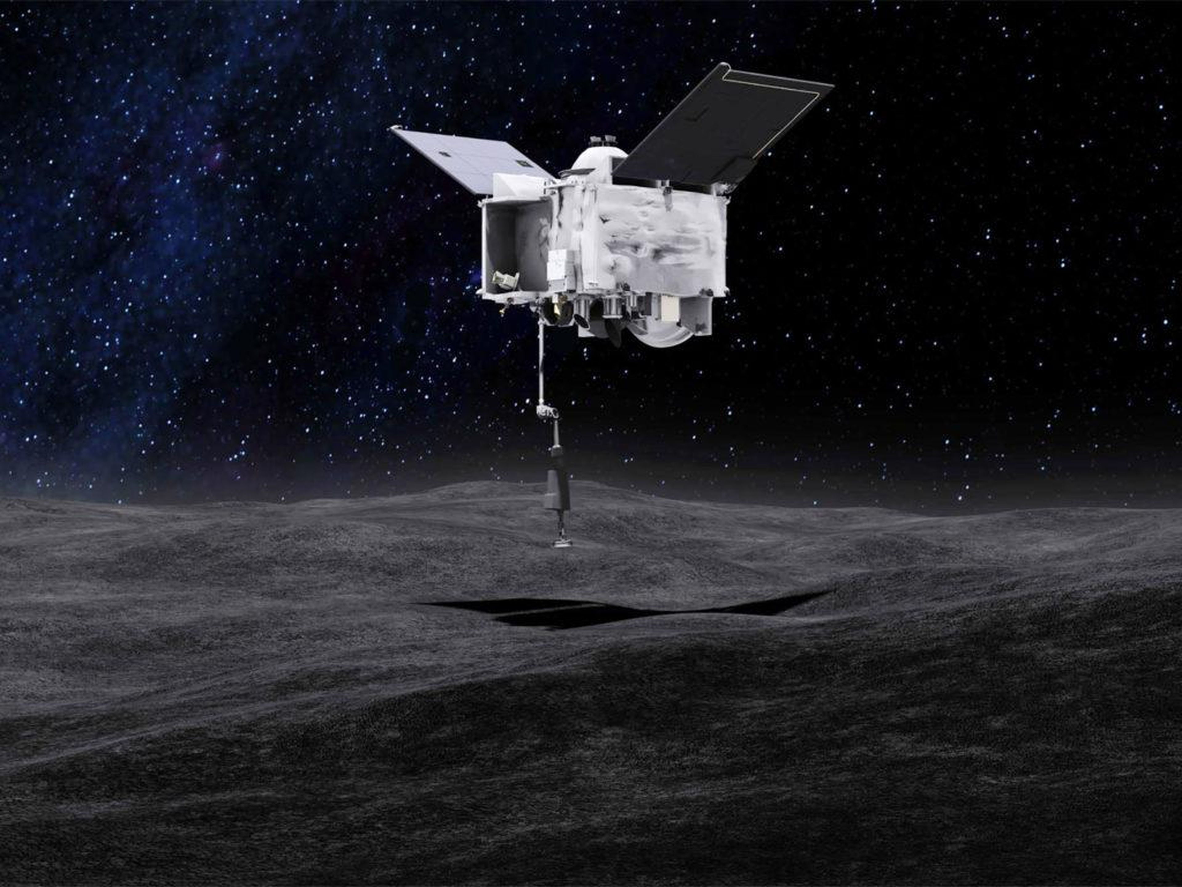 El concepto de este artista muestra la nave espacial OSIRIS-REx recogiendo una muestra del asteroide Bennu. OSIRIS-REx es un primer paso para aprender a minar asteroides.