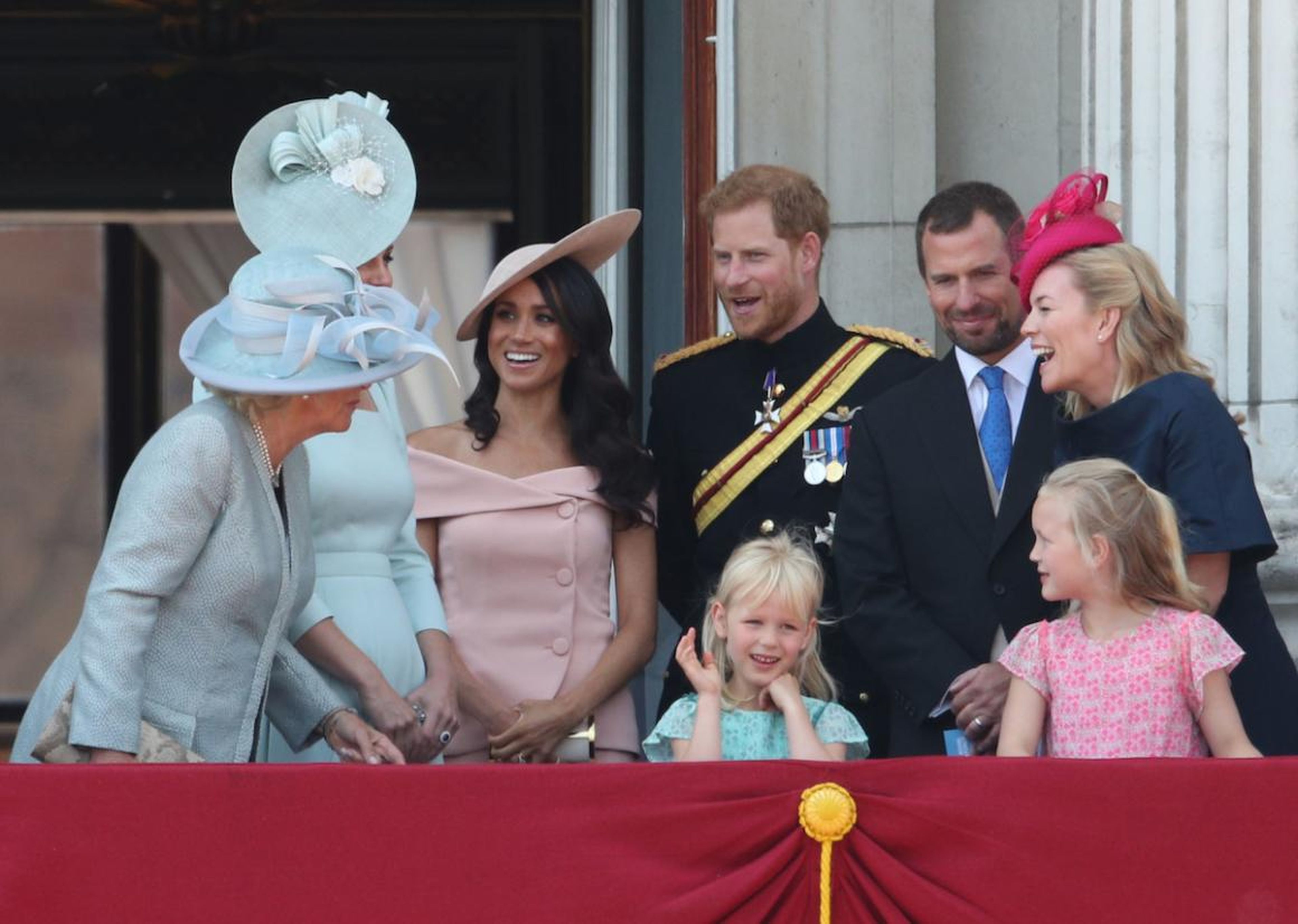 Meghan Markle married into the royal family in May 2018. Just a month after her wedding to Prince Harry, the royal was criticized for "breaking protocol" with an off-the-shoulder dress at the Trooping the Colour parade.