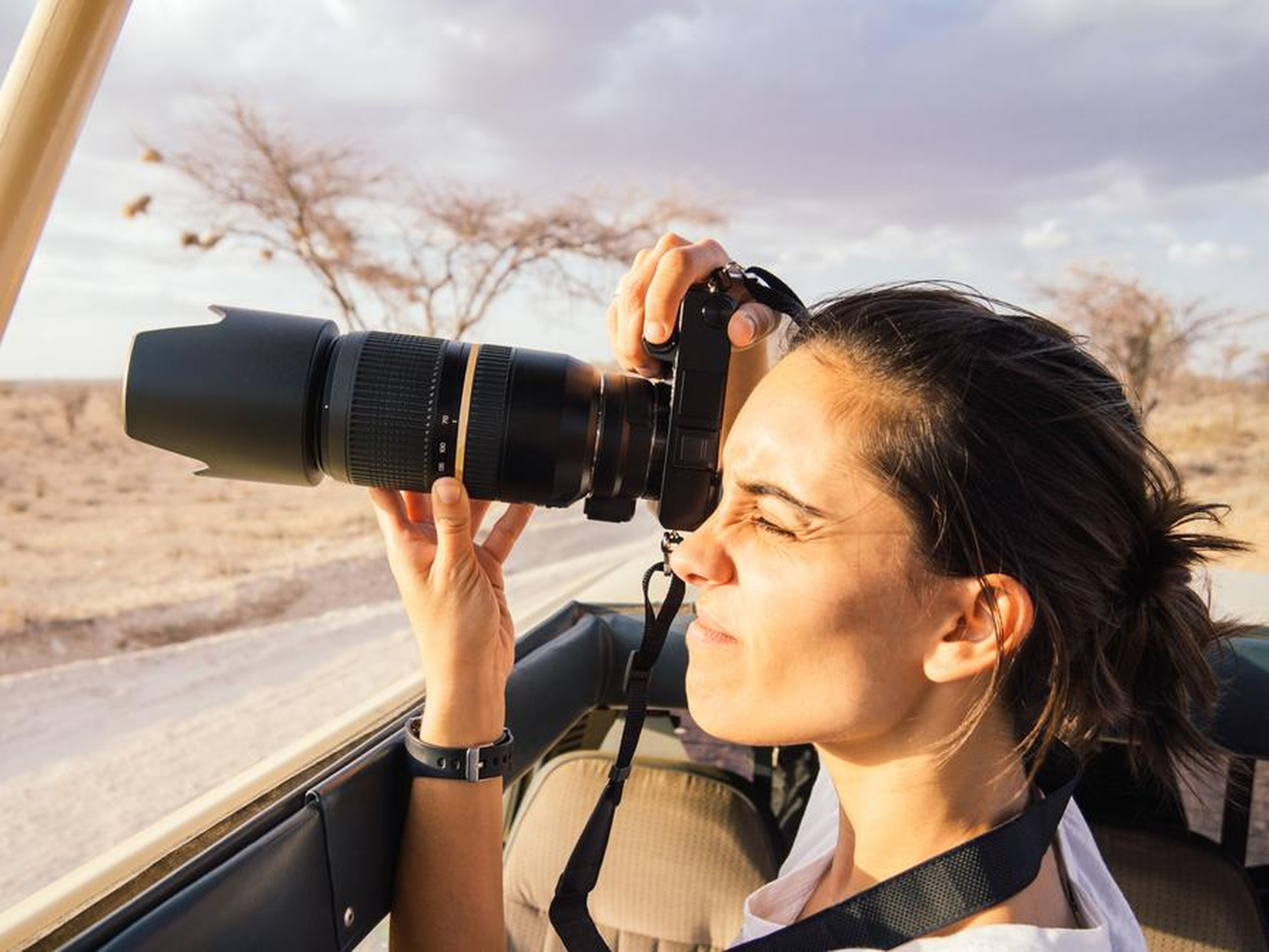 A woman using a camera on Safari.