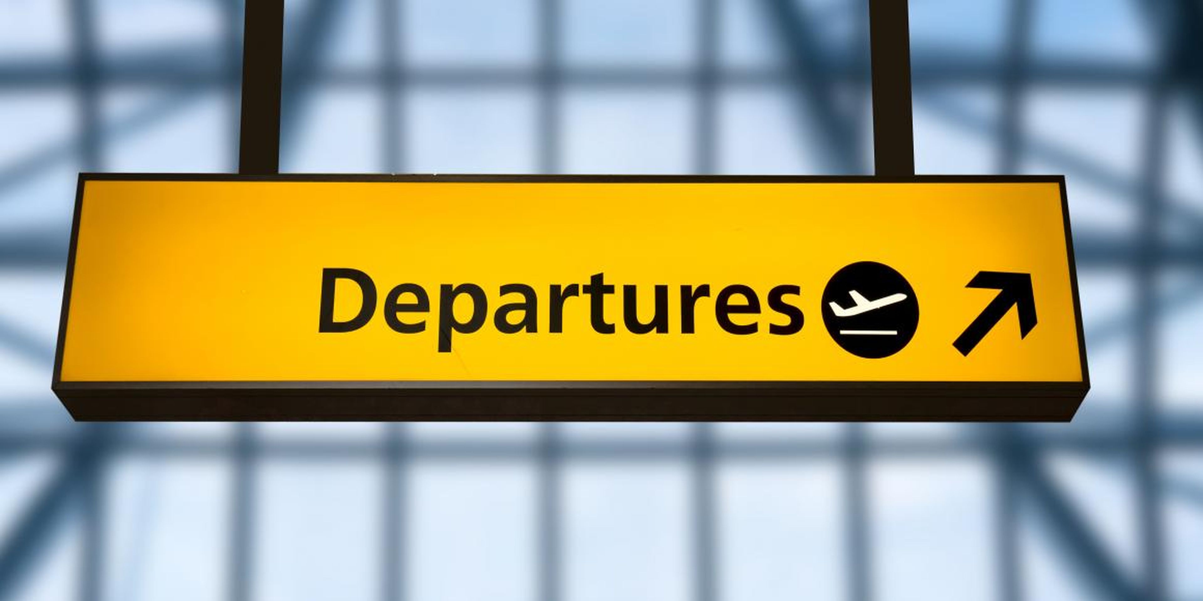 A sign for departures at Gatwick Airport, UK.