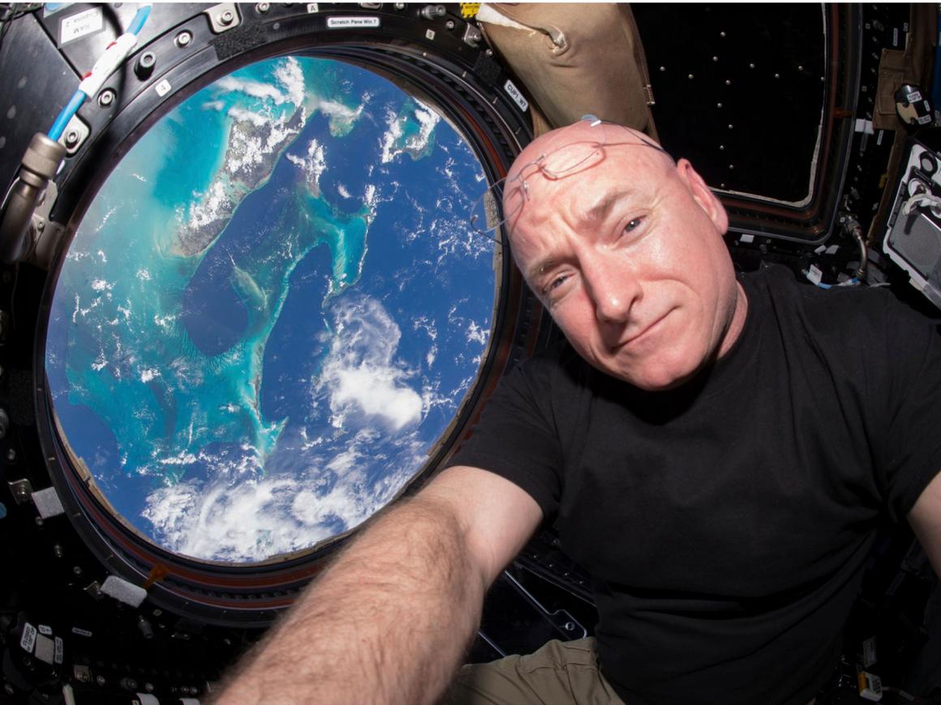 Astronaut Scott Kelly floats inside the windowed Cupola of the International Space Station on March 11, 2016.
