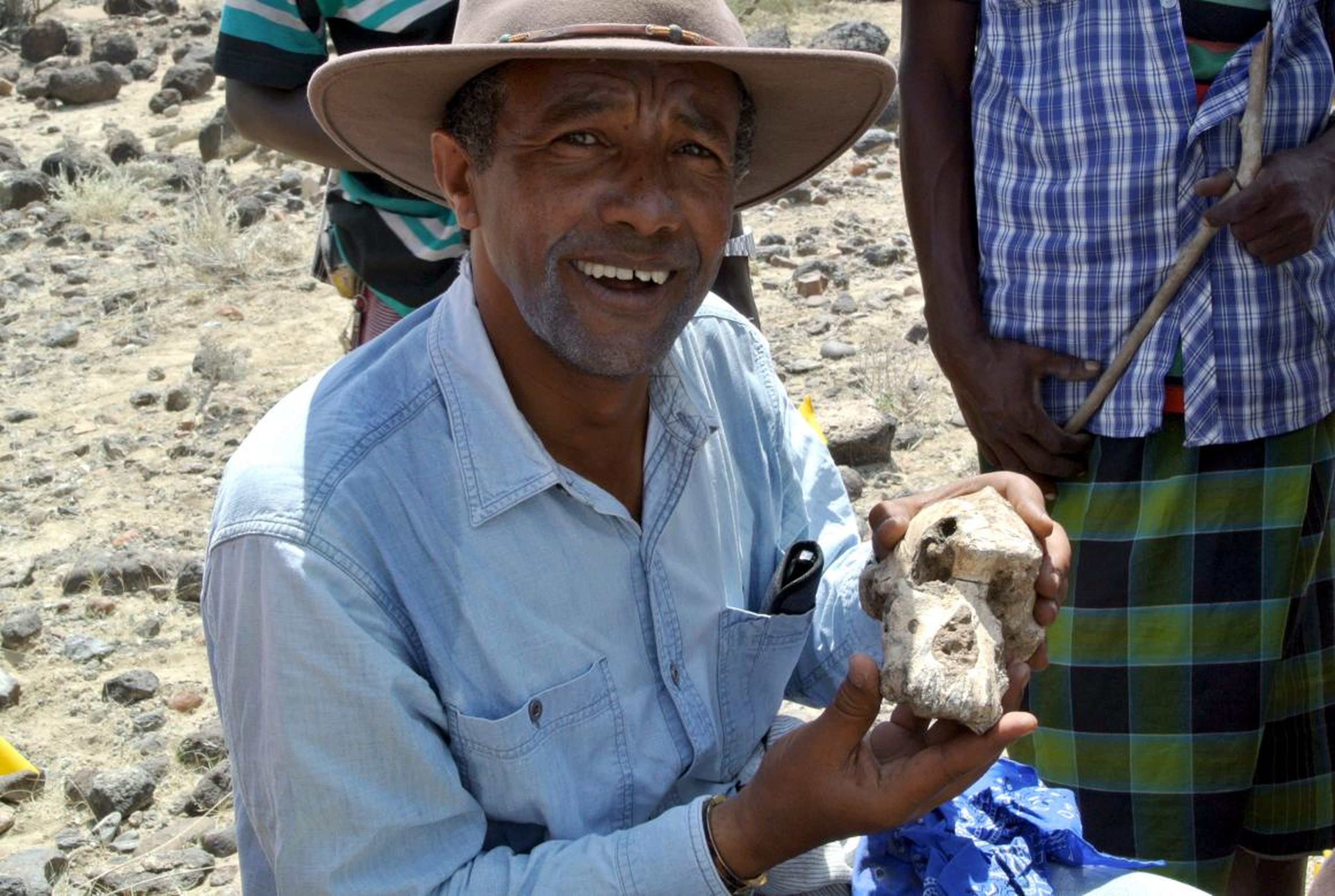 Anthropologist Yohannes Haile-Selassie holds the Australopithecus anamensis skull known as “MRD.”