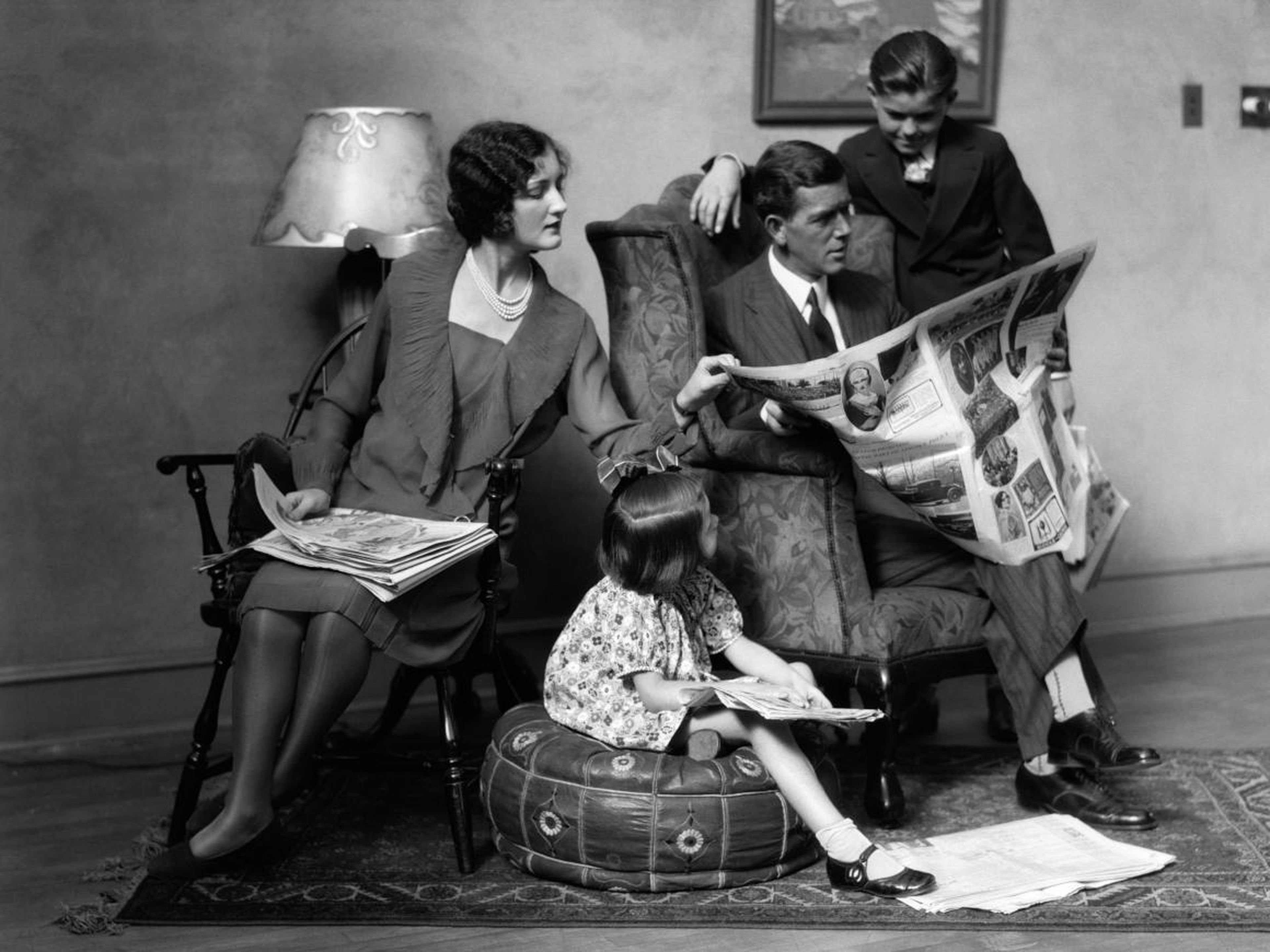 A family reading the paper, circa 1927.