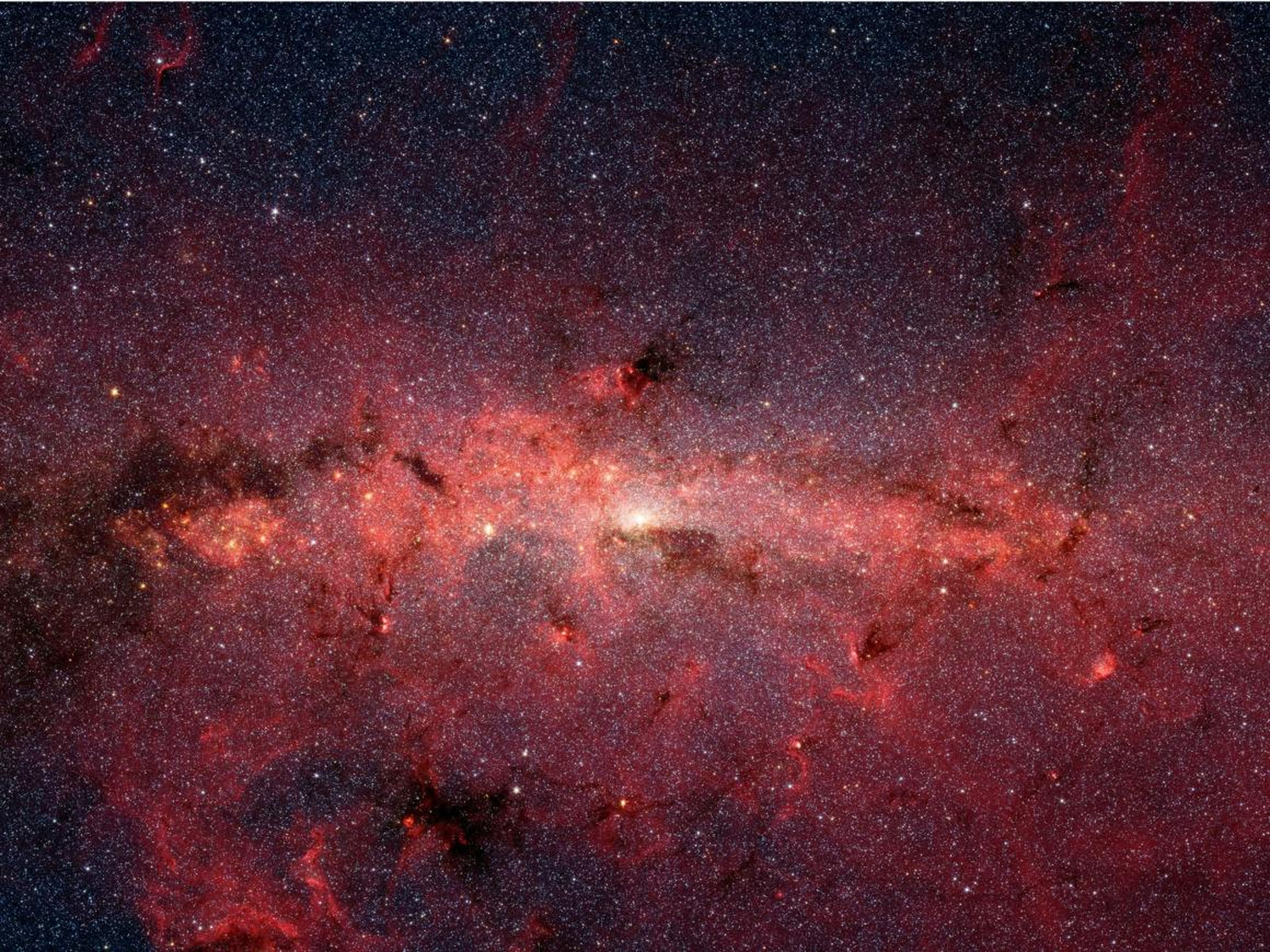 El centro de nuestra Vía Láctea, visualizado por las cámaras infrarrojas del Telescopio Espacial Spitzer.