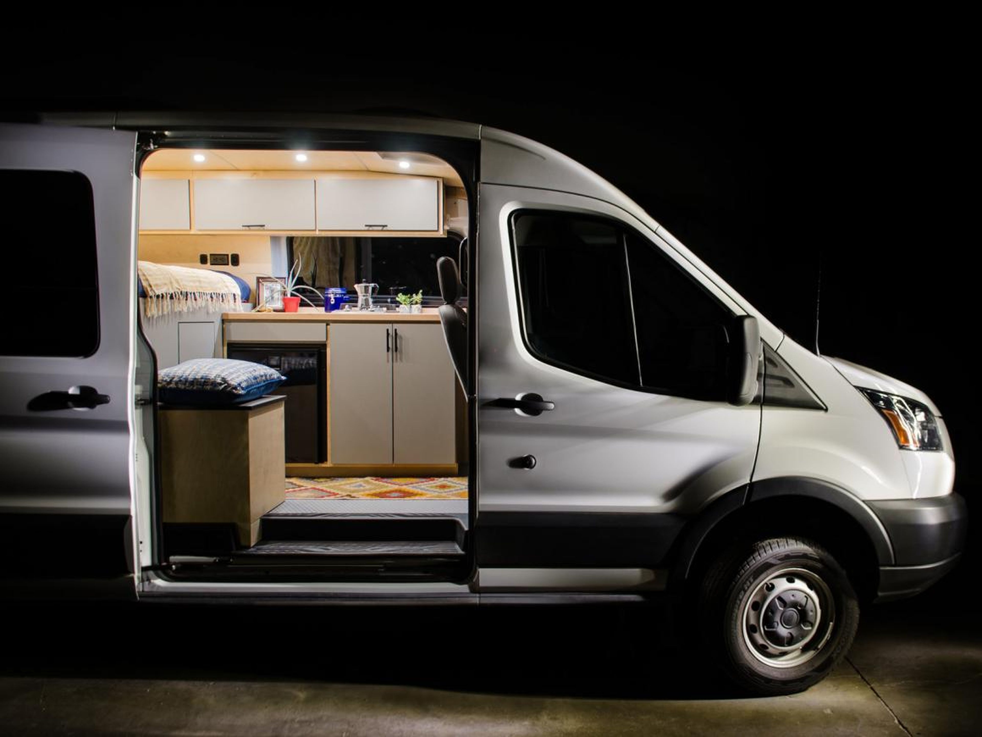 This custom tiny home on wheels was made from a Ford Transit van