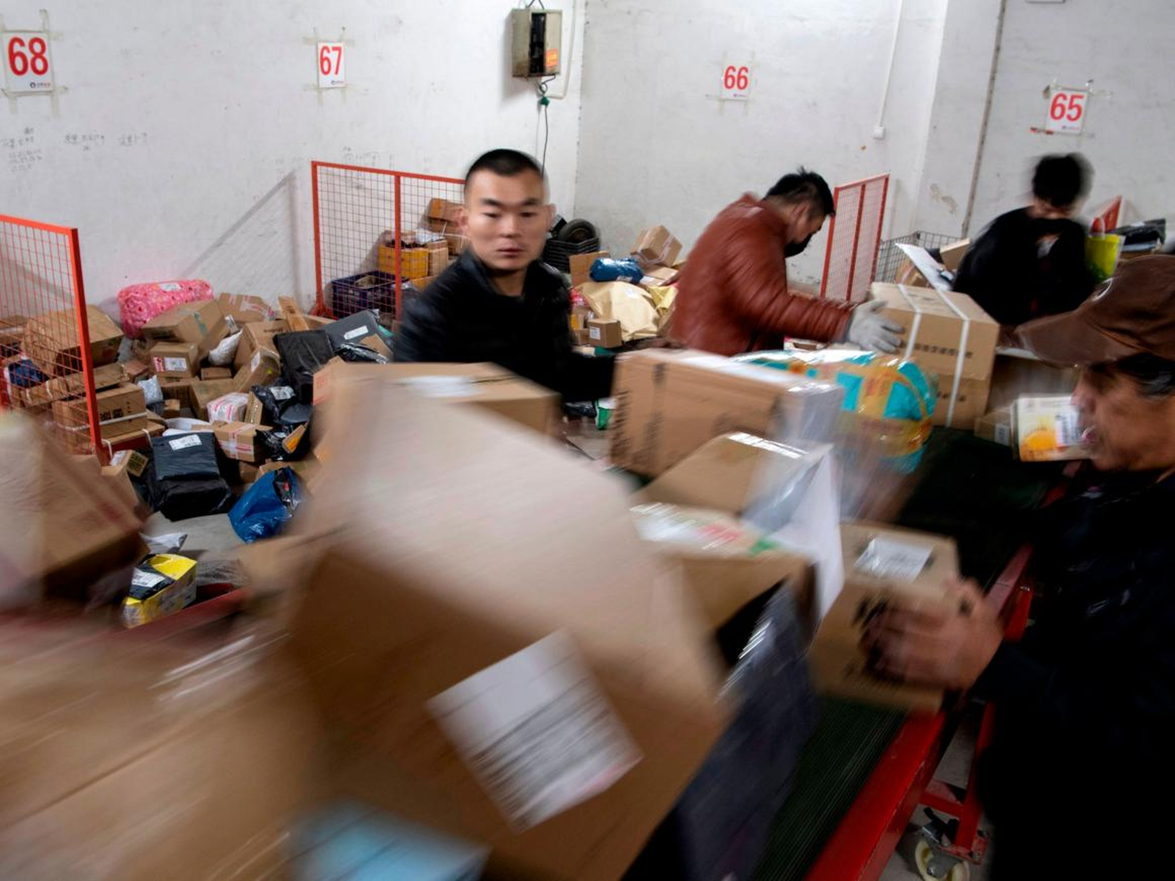 Employees have already been pictured sorting packages in Chinese warehouses in Beijing to get them on the way to customers.