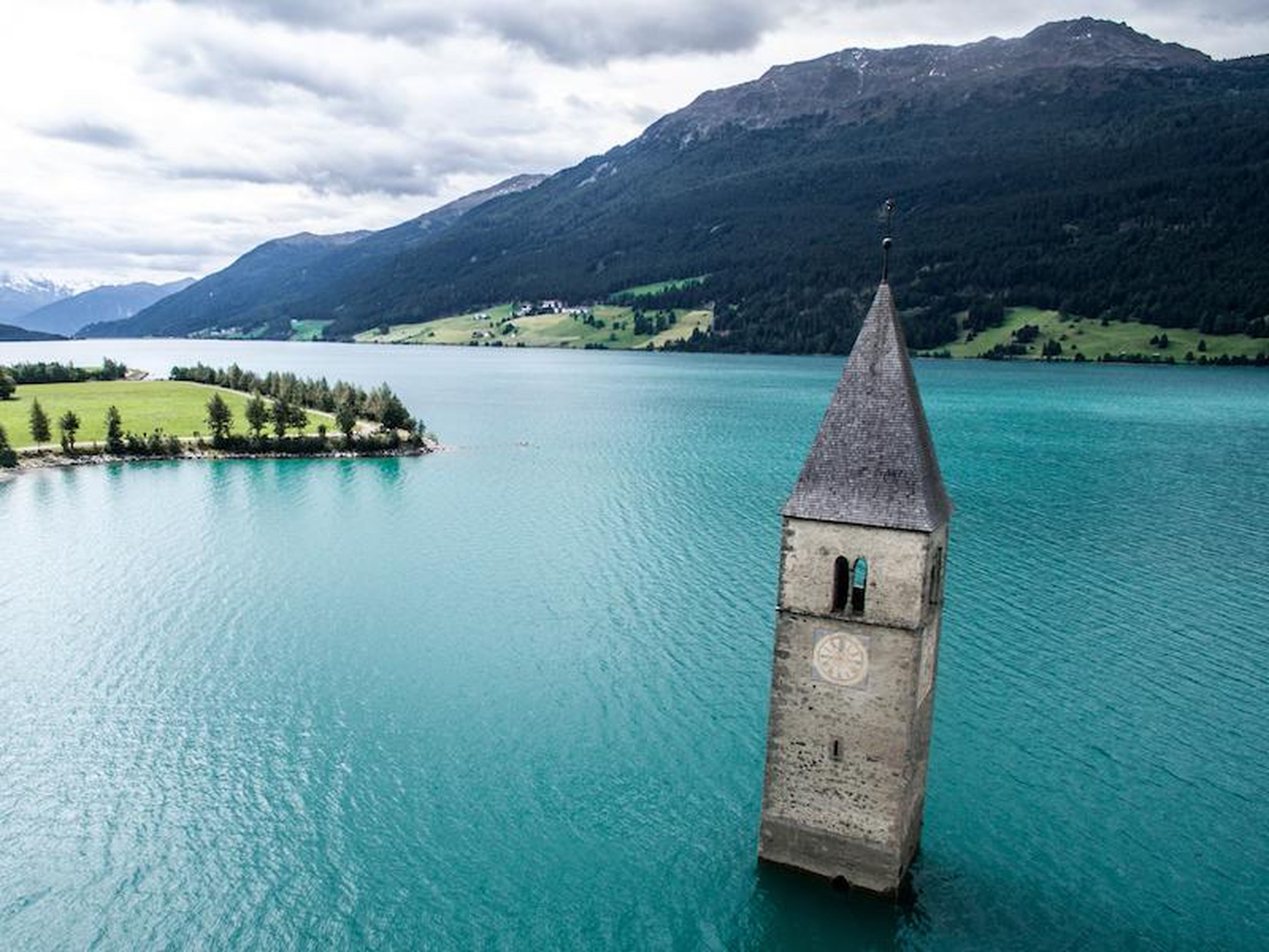 Only the tower of this church still remains above water on Lake Reschen.