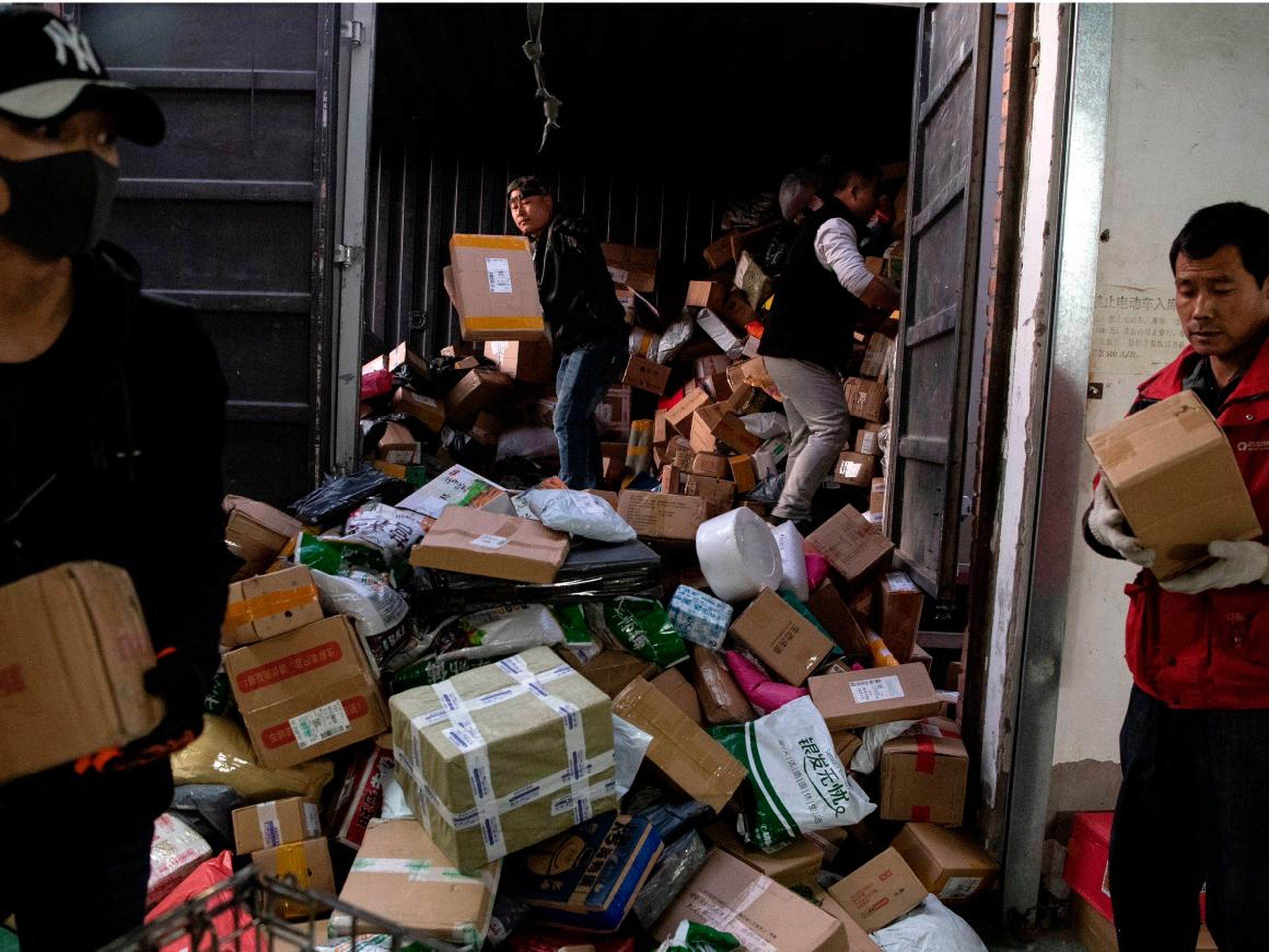 Photos show Singles Day packages piling up in warehouses in Beijing, China, and some warehouses look more crowded than others.