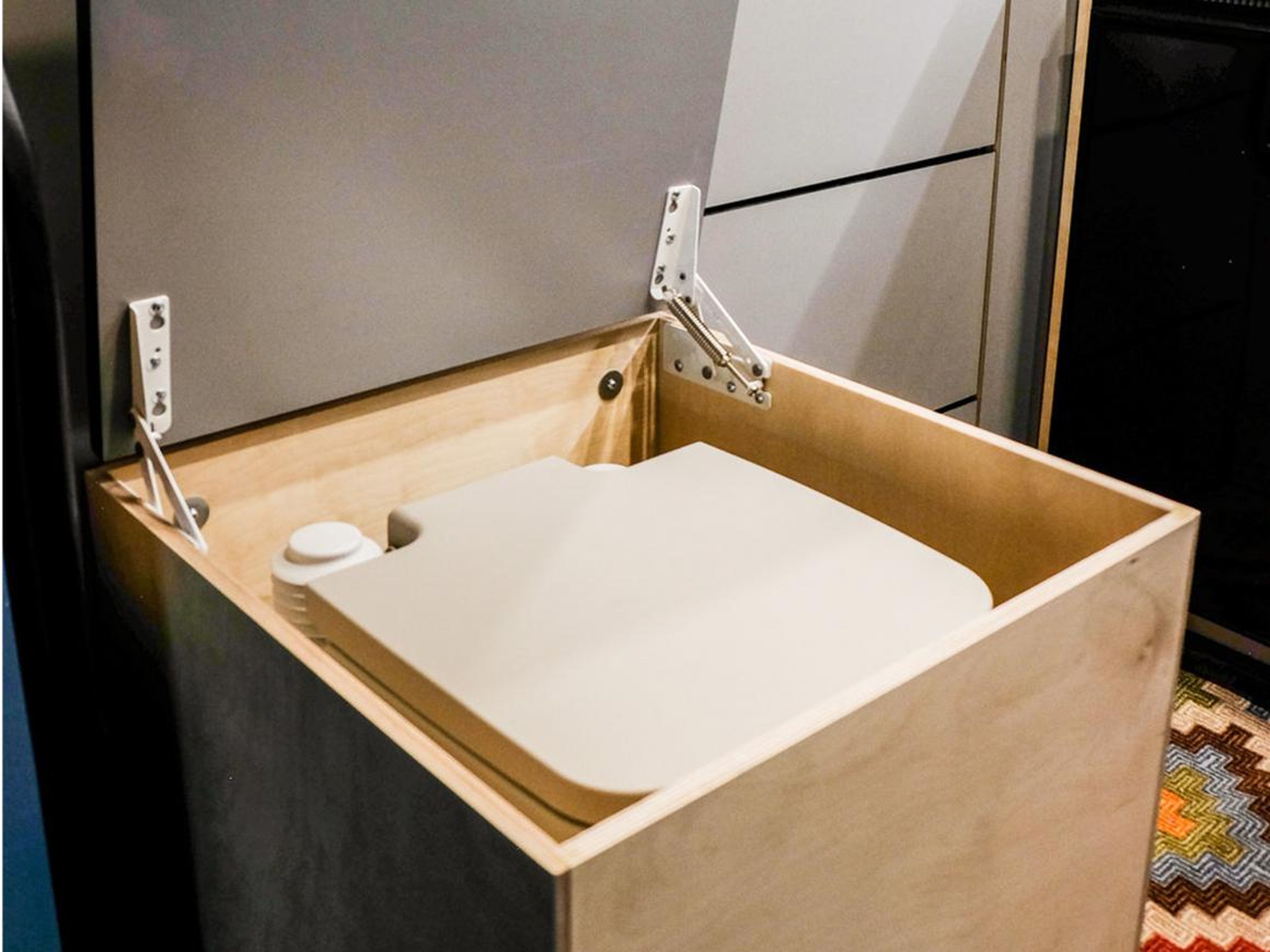 The storage bench that hides the cassette toilet doubles as a seating unit.