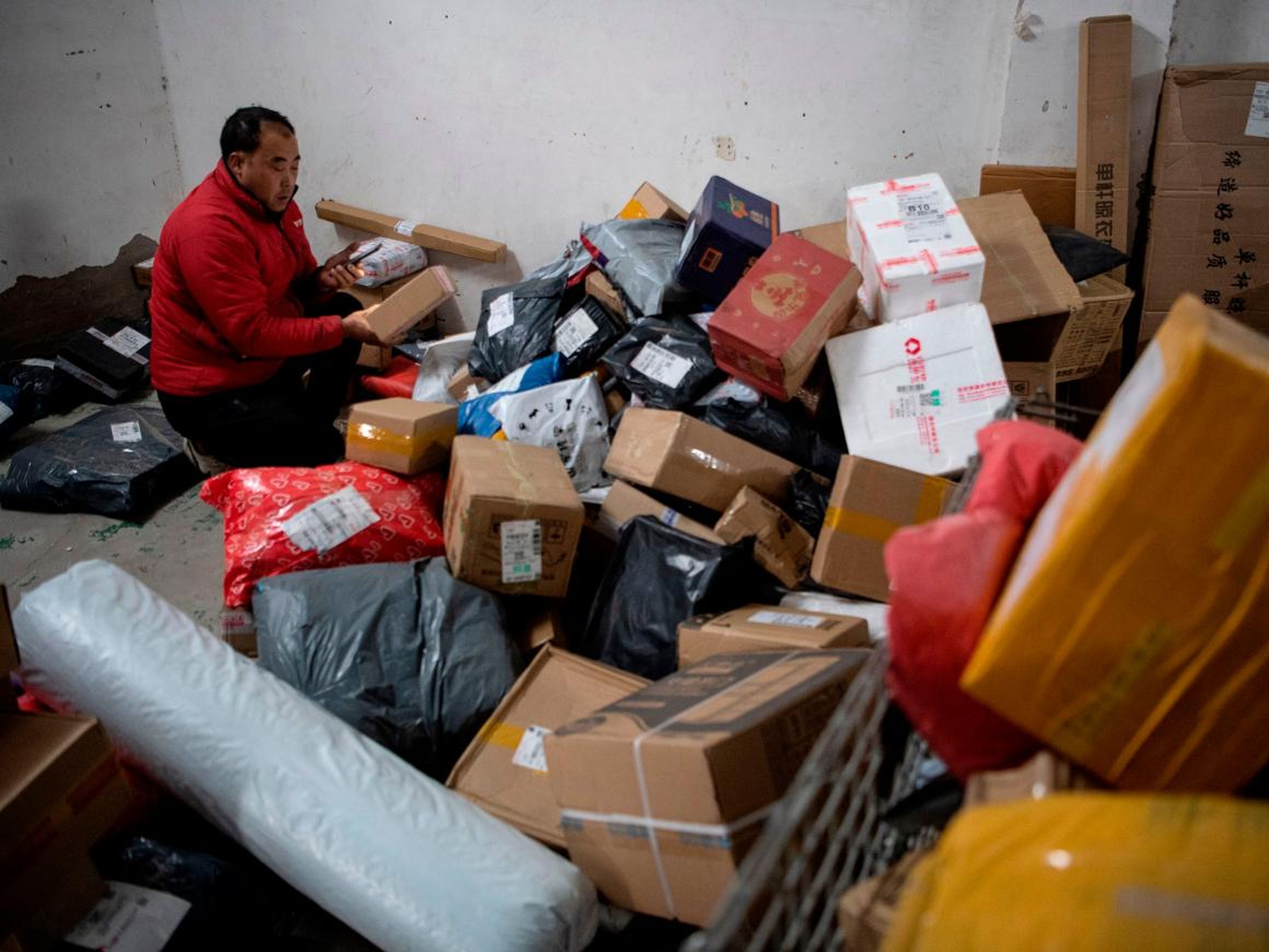 Workers in chaotic-looking warehouses appear to be struggling to keep up with the large number of Singles' Day orders.