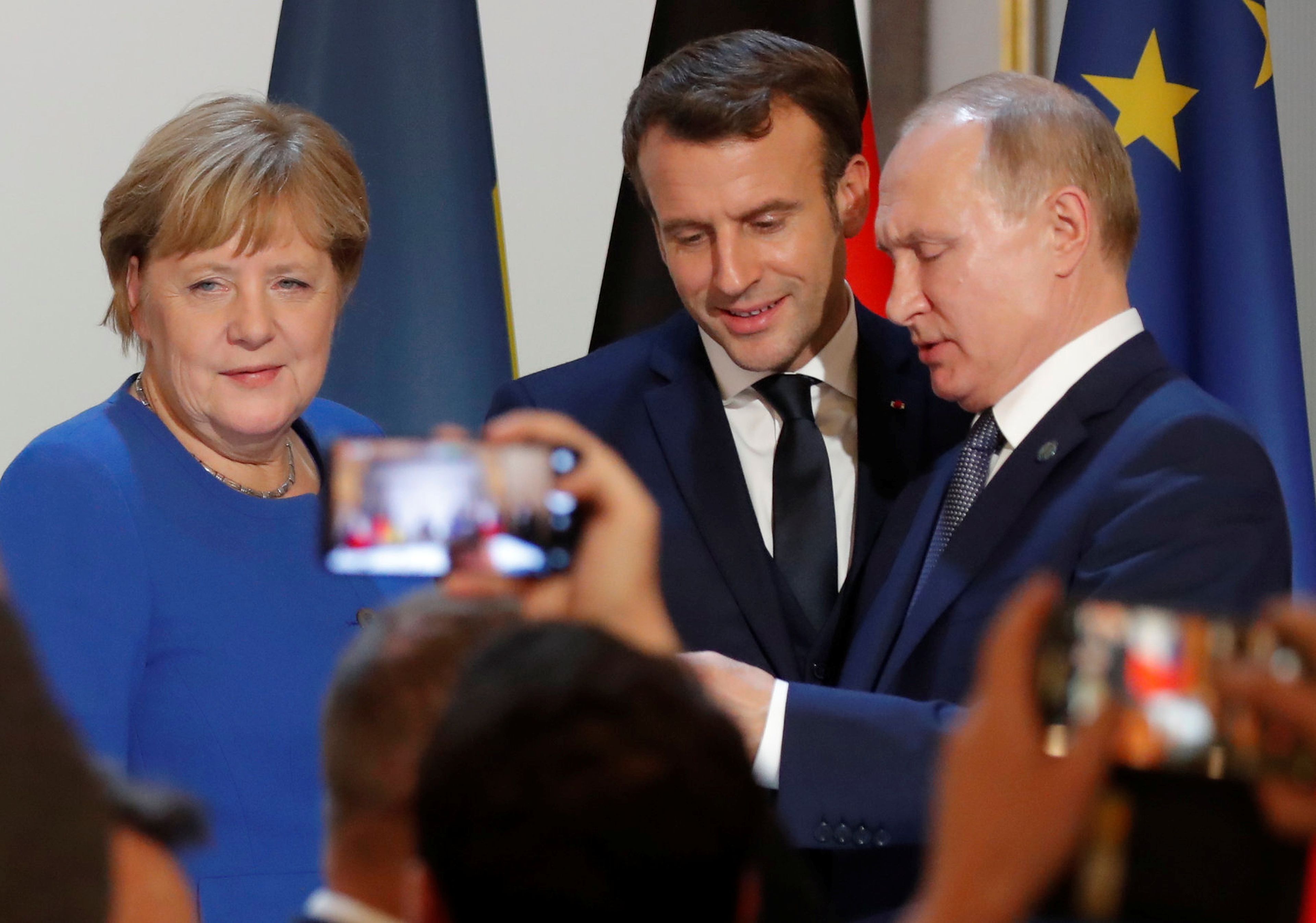 Angela Merkel, Emmanuel Macron y Vladimir Putin
