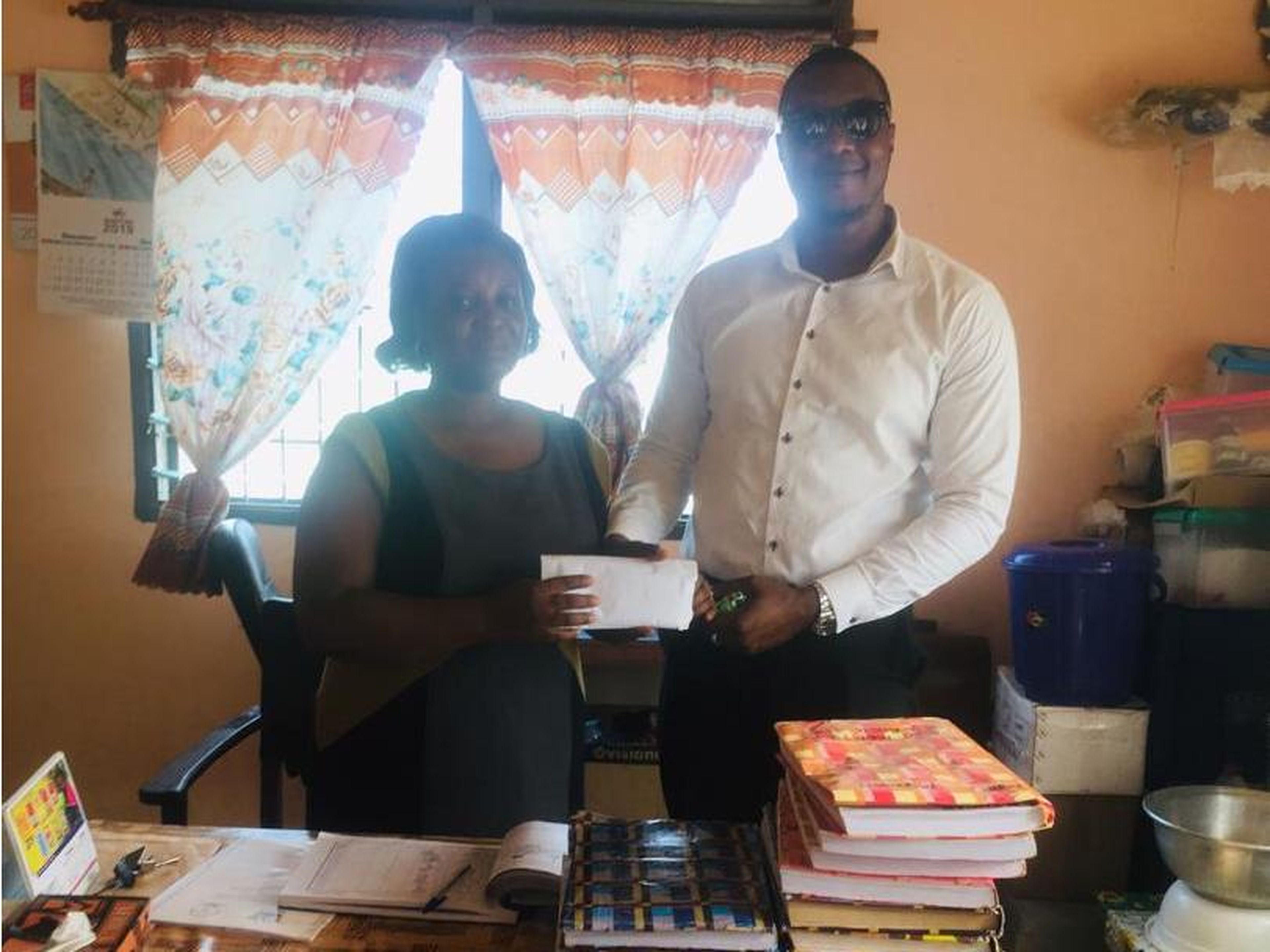 Asante converted the MTL into cash on the school's behalf and delivered it to the school's headmistress.
