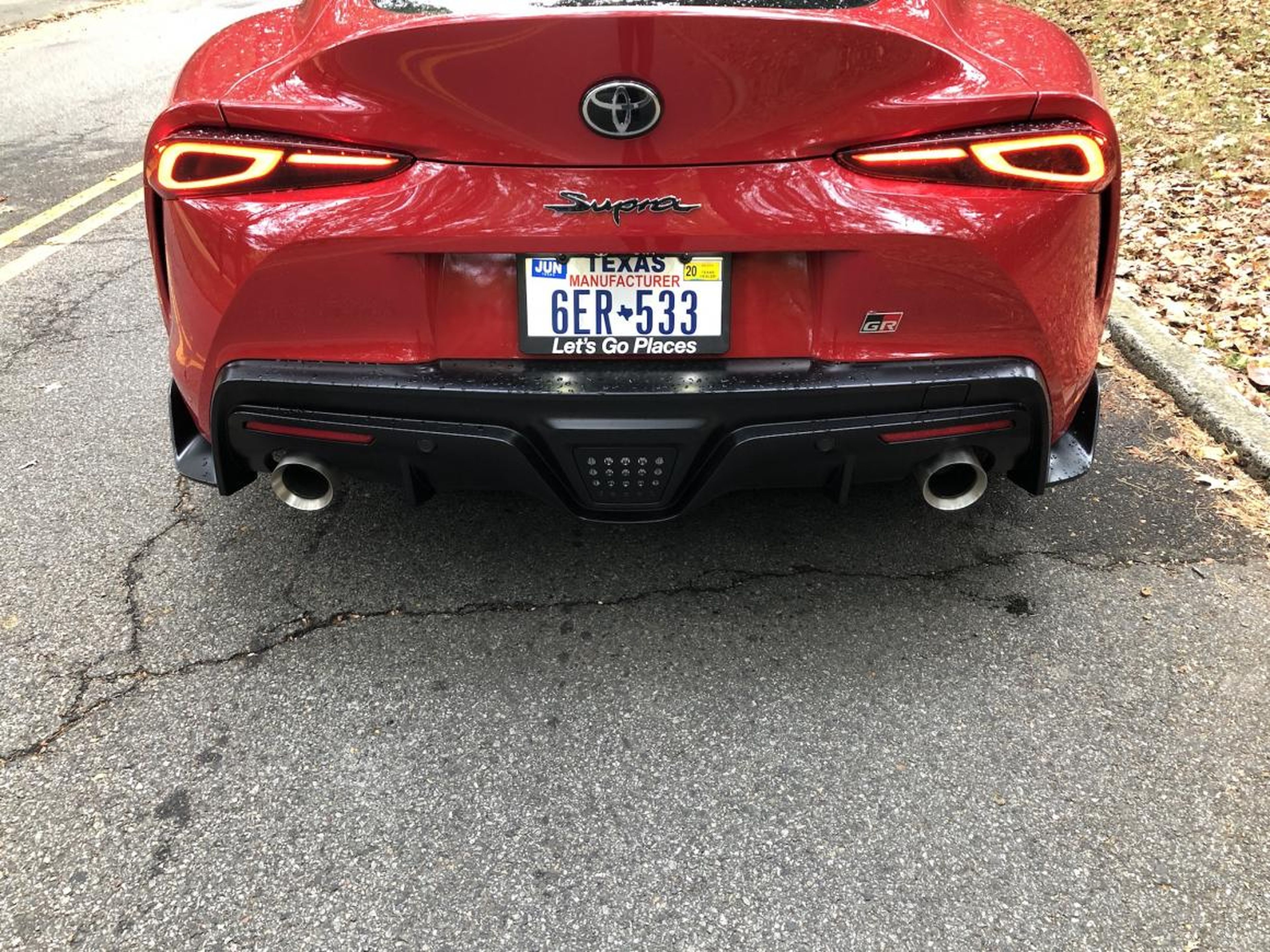 Dual exhaust pipes are a clue that this car has some serious giddy-up. There's also a modest rear diffuser.