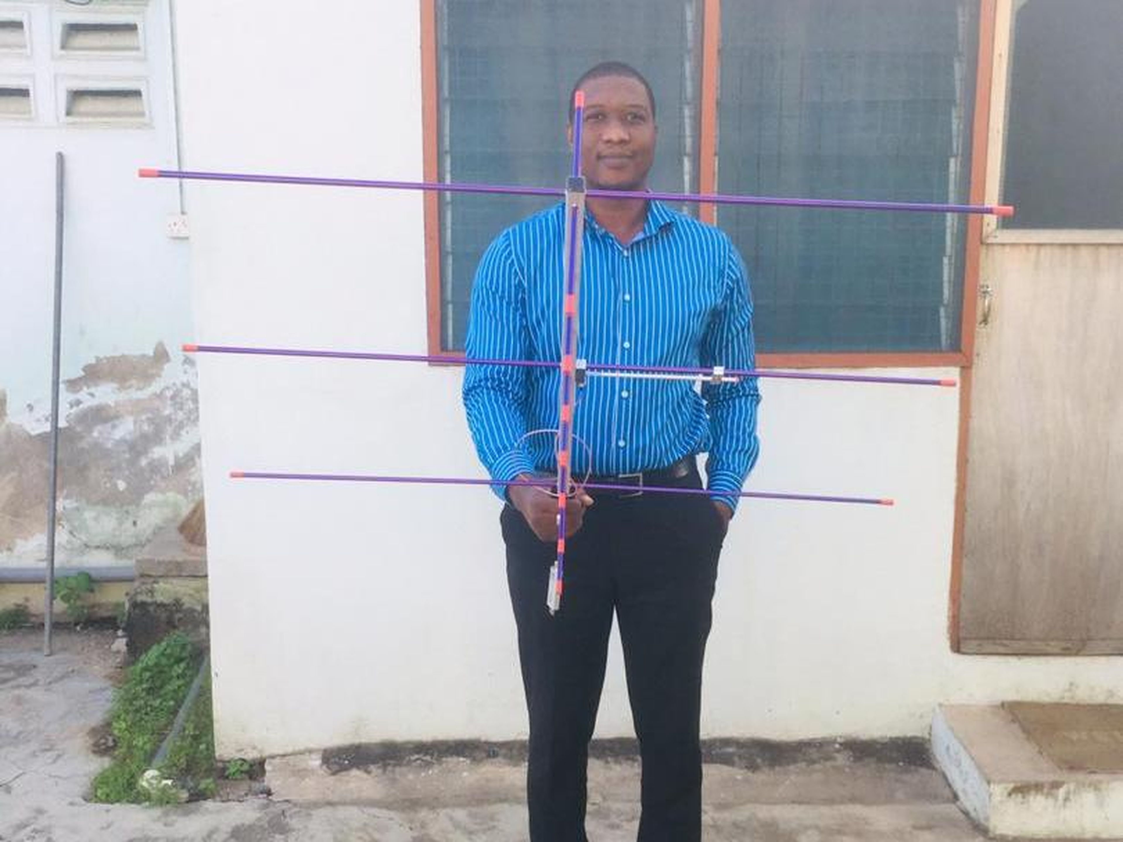 Here is Kwame "Larry" Asante holding the antenna he built to receive the MTL from the crypto space drop.