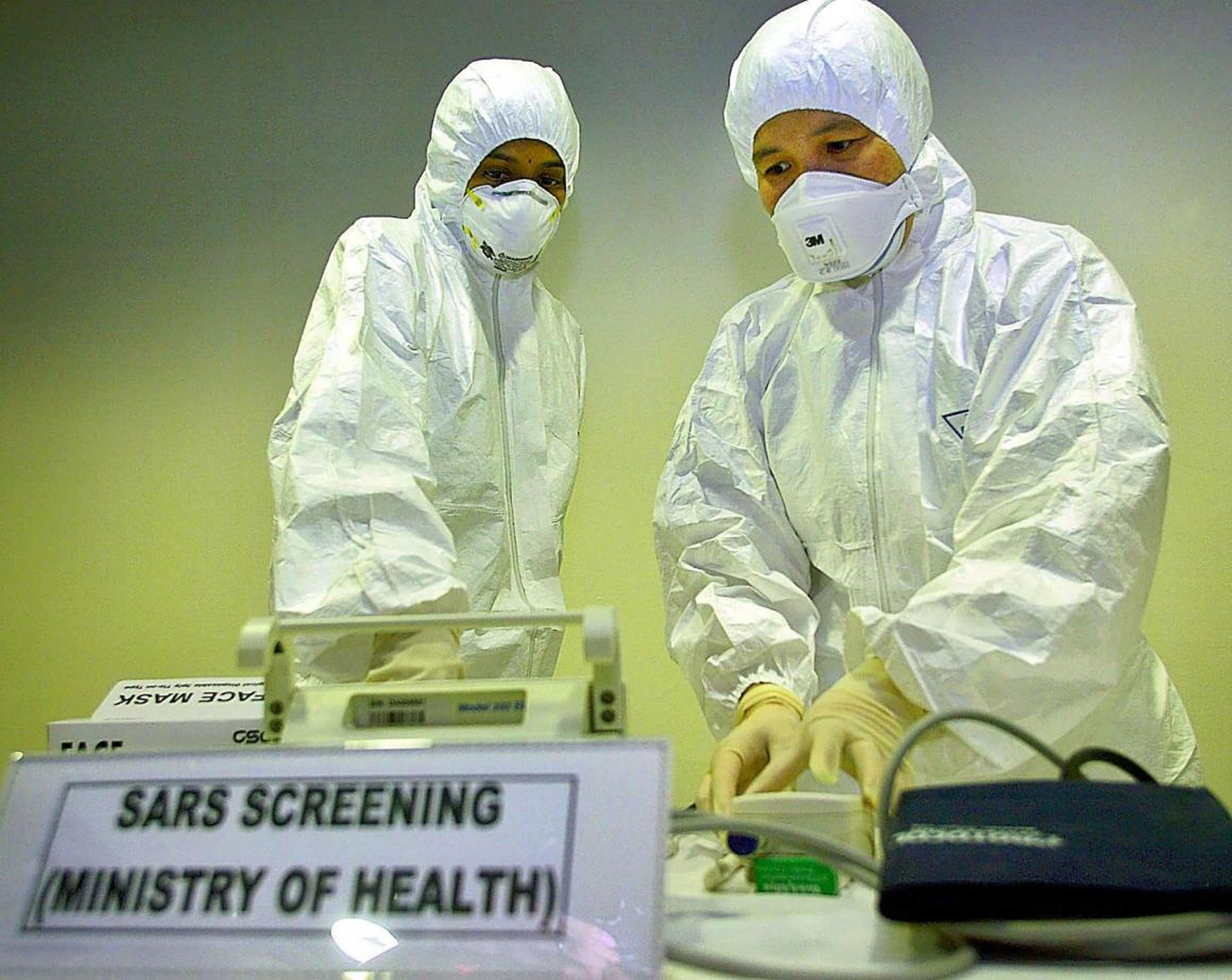 A doctor checking equipment at a SARS screening room at Kuala Lumpur International Airport in Malaysia in 2003.