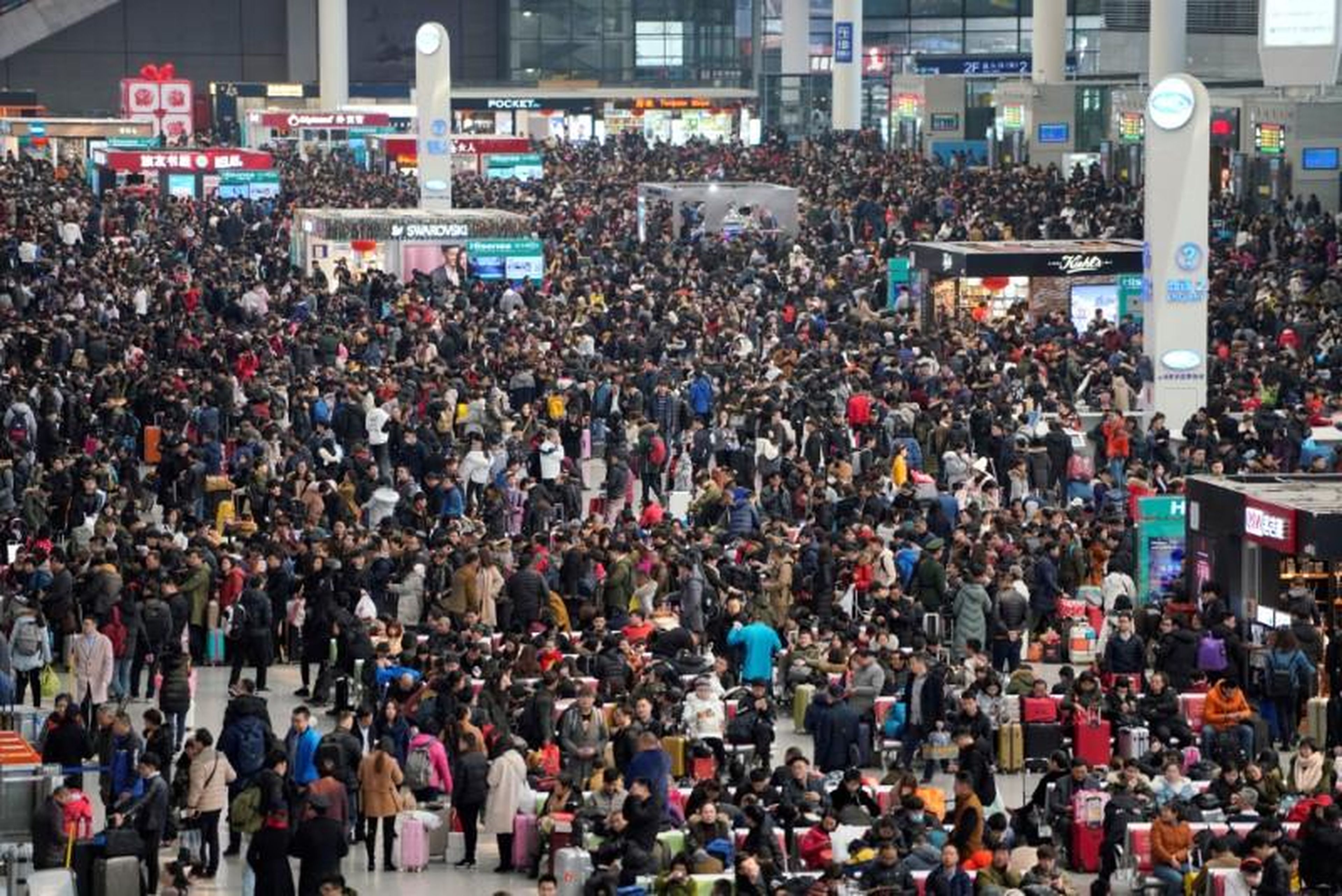 Passengers waiting to board trains at Shanghai's Hongqiao Railway Station ahead of the Lunar New Year in February 2018.
