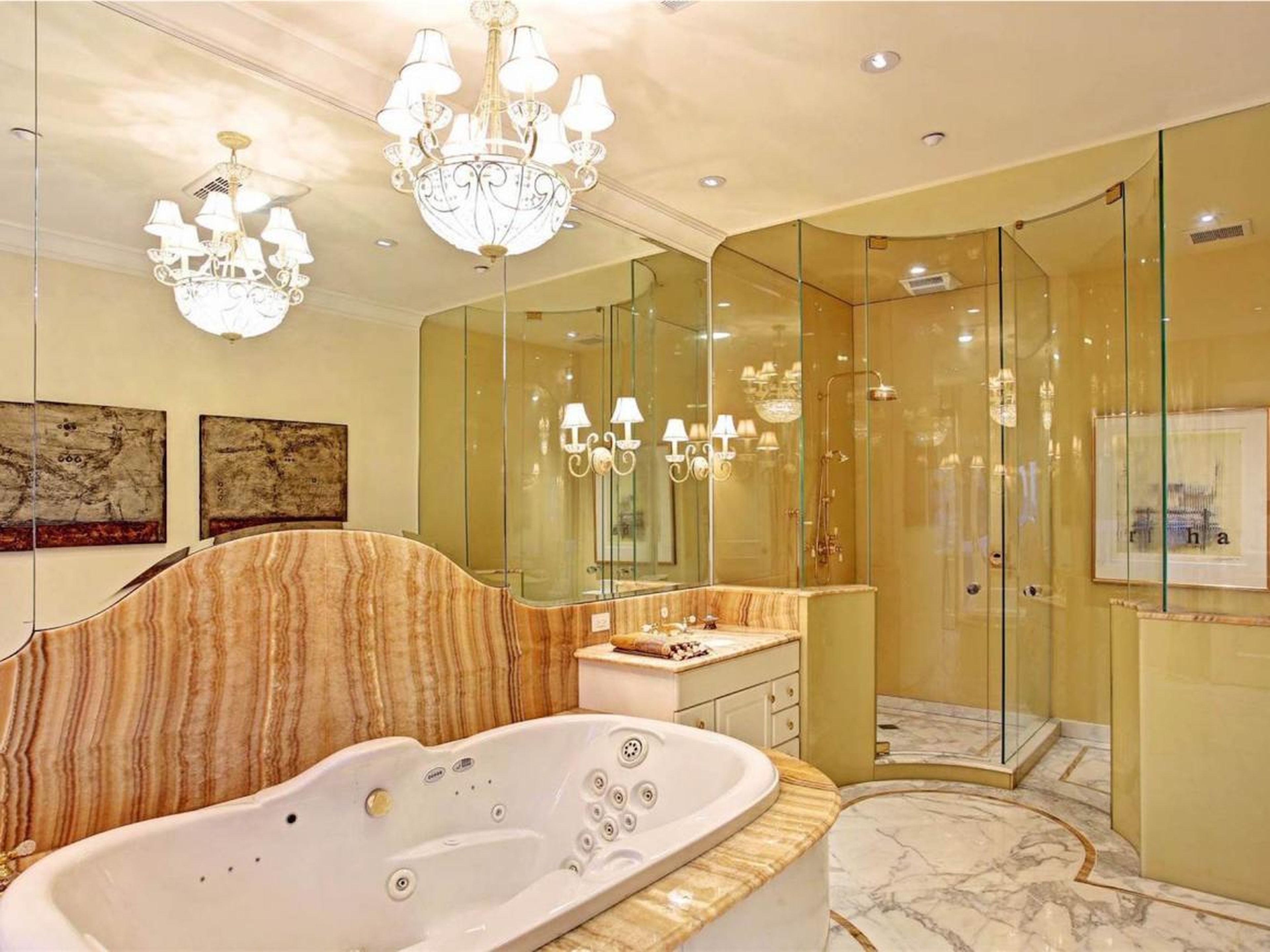 There are eight full bathrooms and three half-baths. Many feature granite flooring, marble countertops, a shower, a tub, and a crystal chandelier that dresses up a room.
