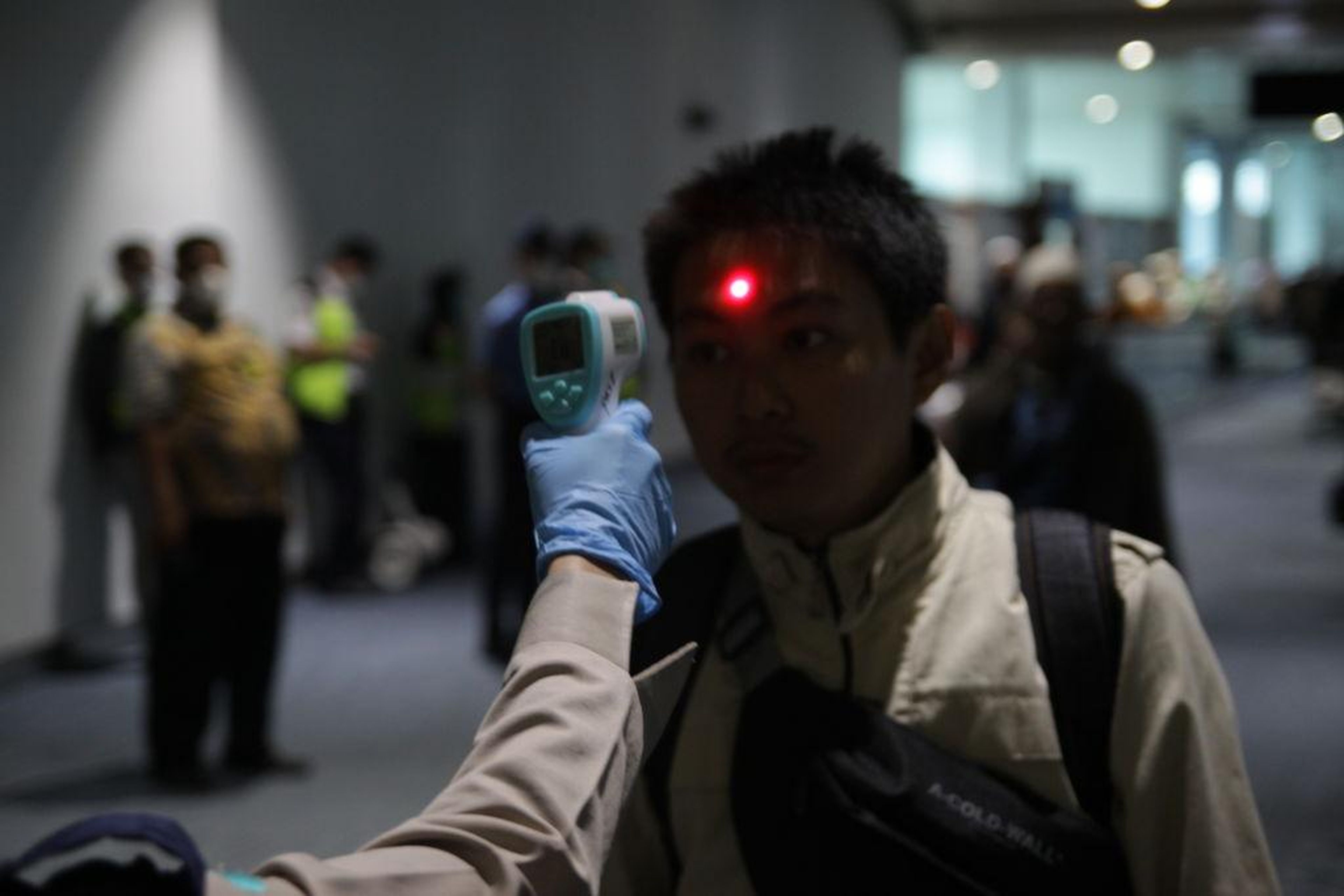 The Health Quarantine officers of Soekarno-Hatta International Airport carry out body temperature checks from abroad passengers at Soekarno-Hatta International Airport, Tangerang city.
