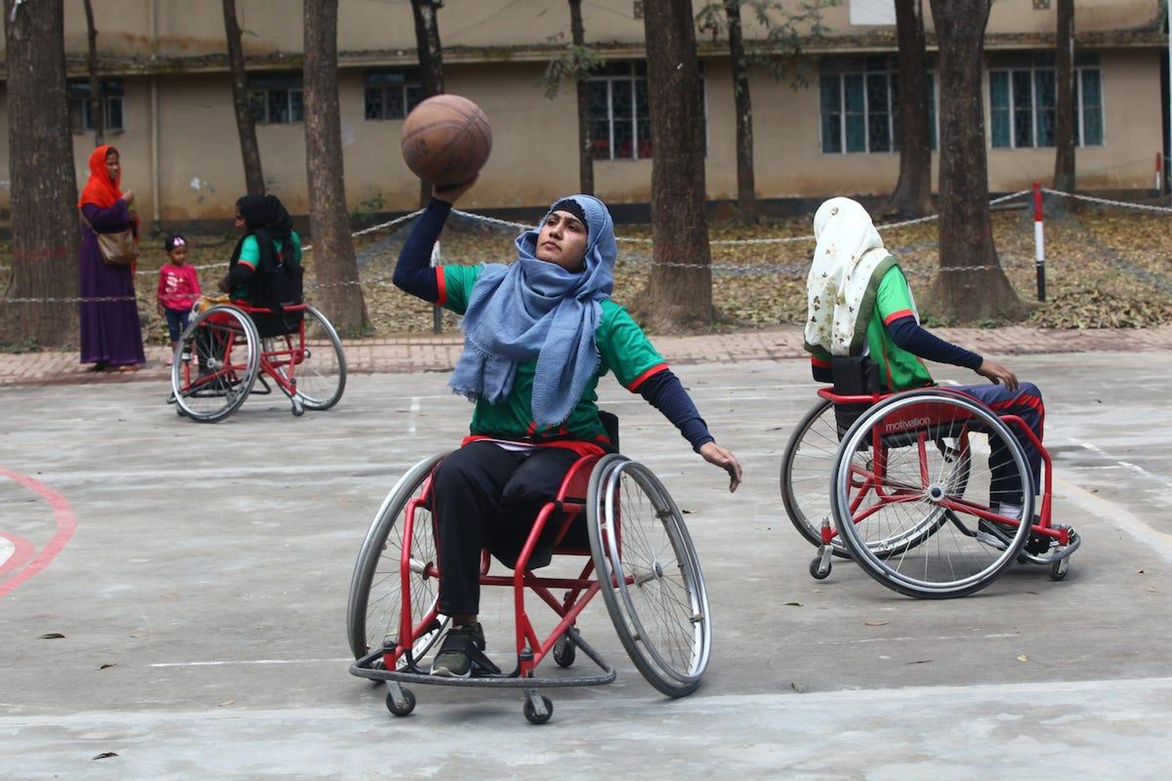 Bangladeshi disabled women playing basketball during a match in Savar on the outskirts of Dhaka on Sunday.