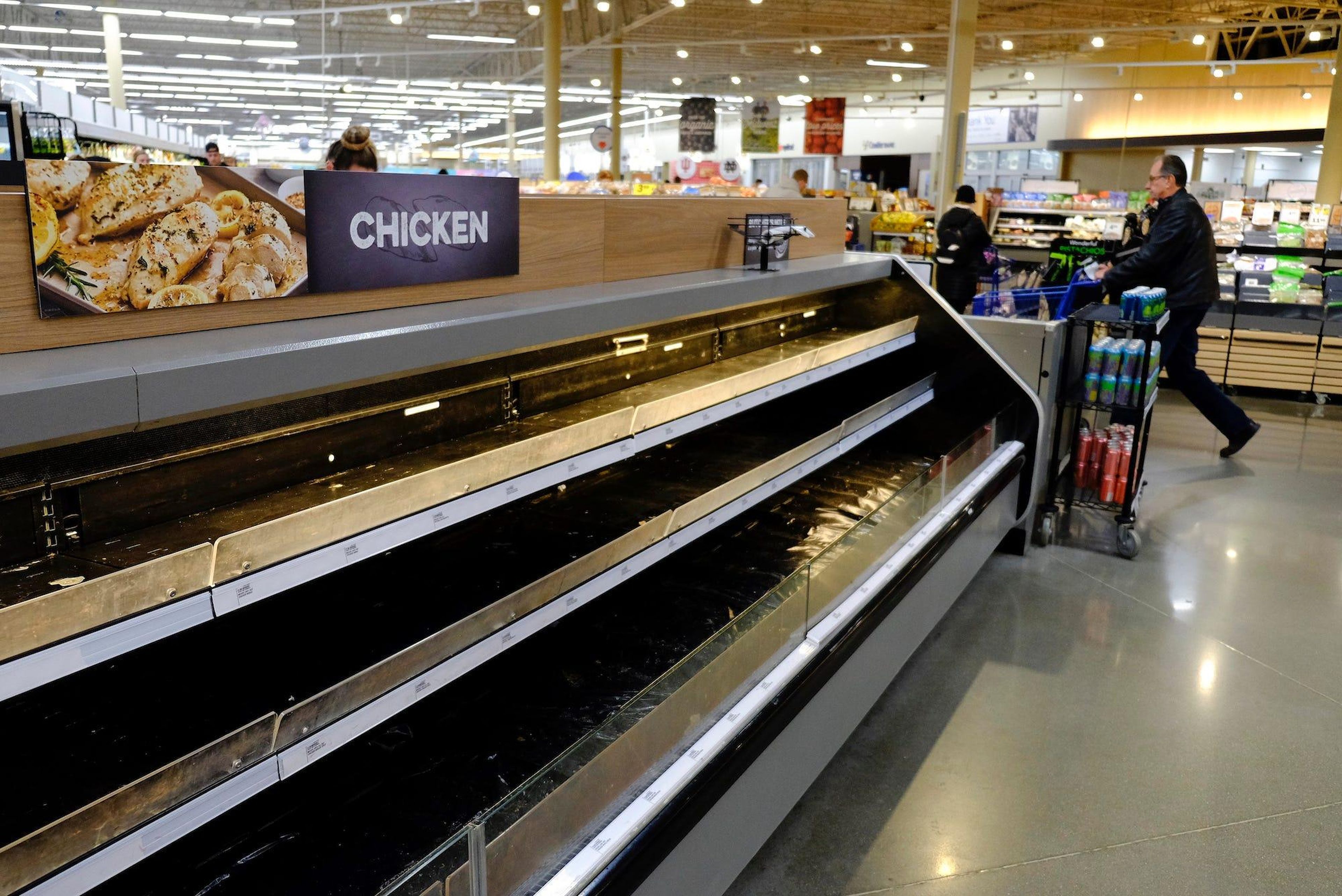 Empty shelves are seen at the Meijer store on Monday, March 16, 2020, in Whitestown, Indiana, amid the coronavirus outbreak.