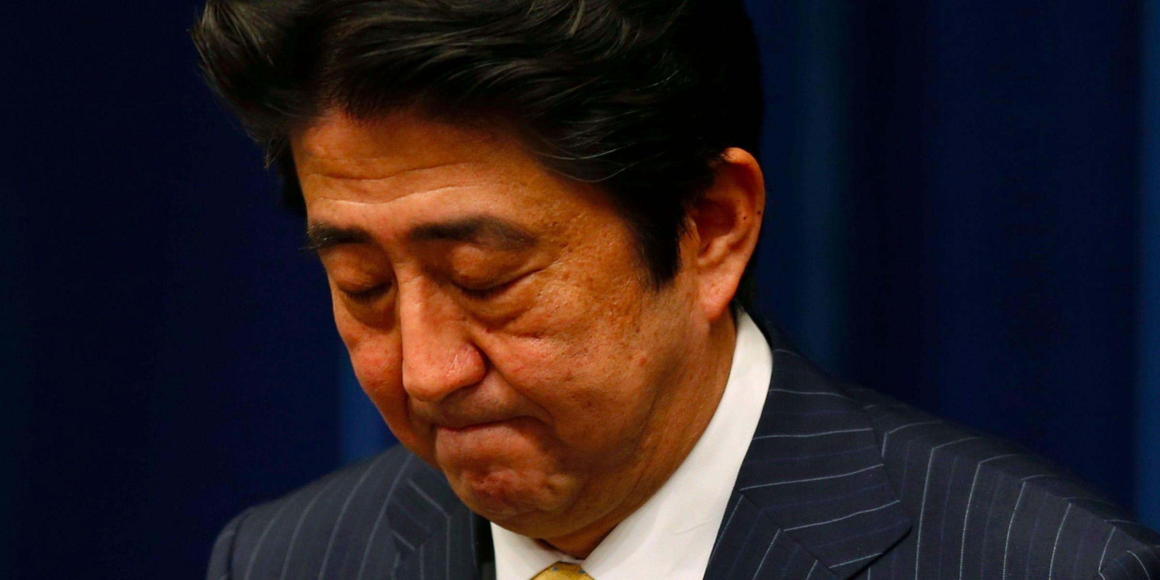 Japan's Prime Minister Shinzo Abe bows at the end of a news conference at his official residence in Tokyo June 26, 2013