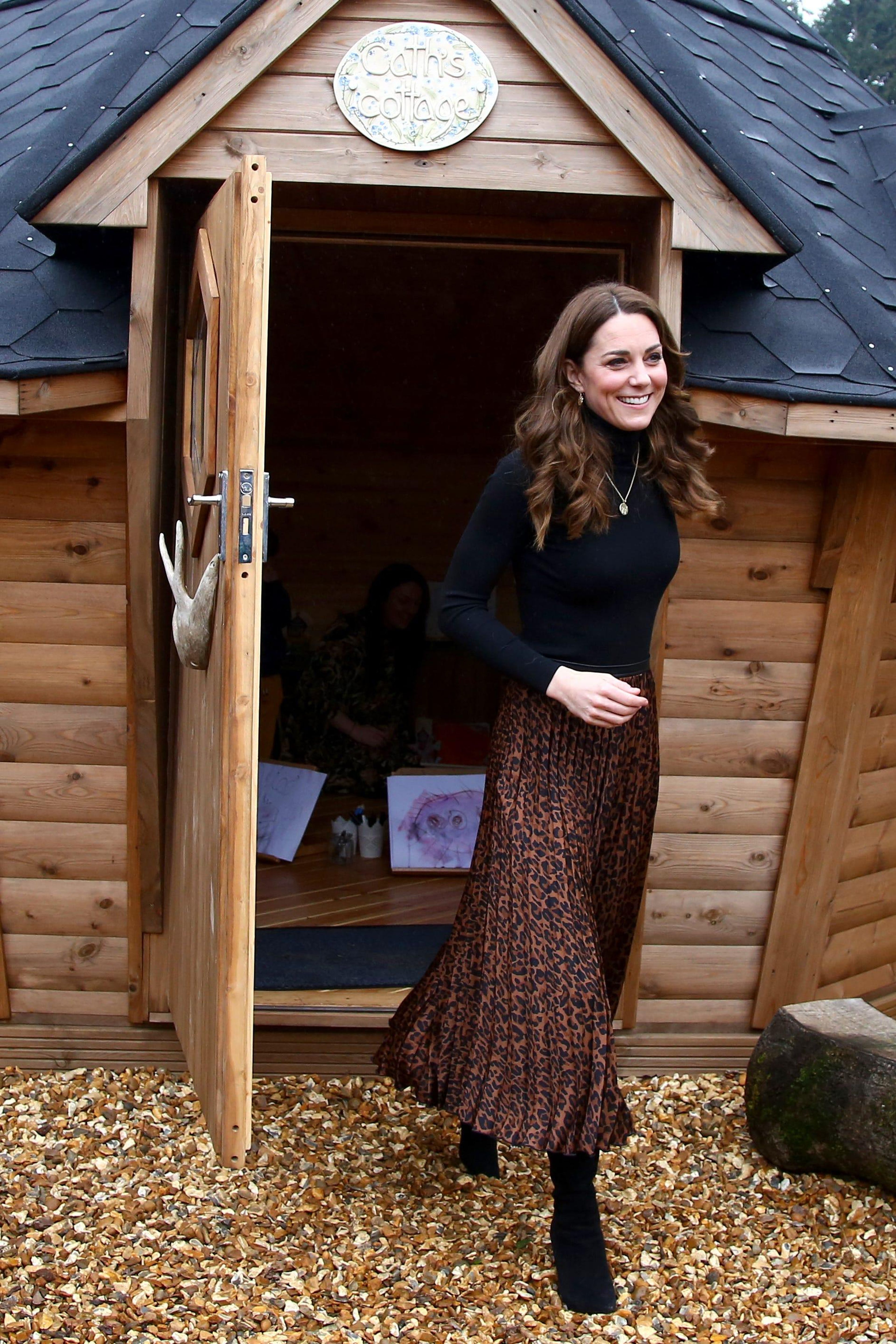 Kate Middleton paired a black turtleneck with a $13 Zara animal print skirt.