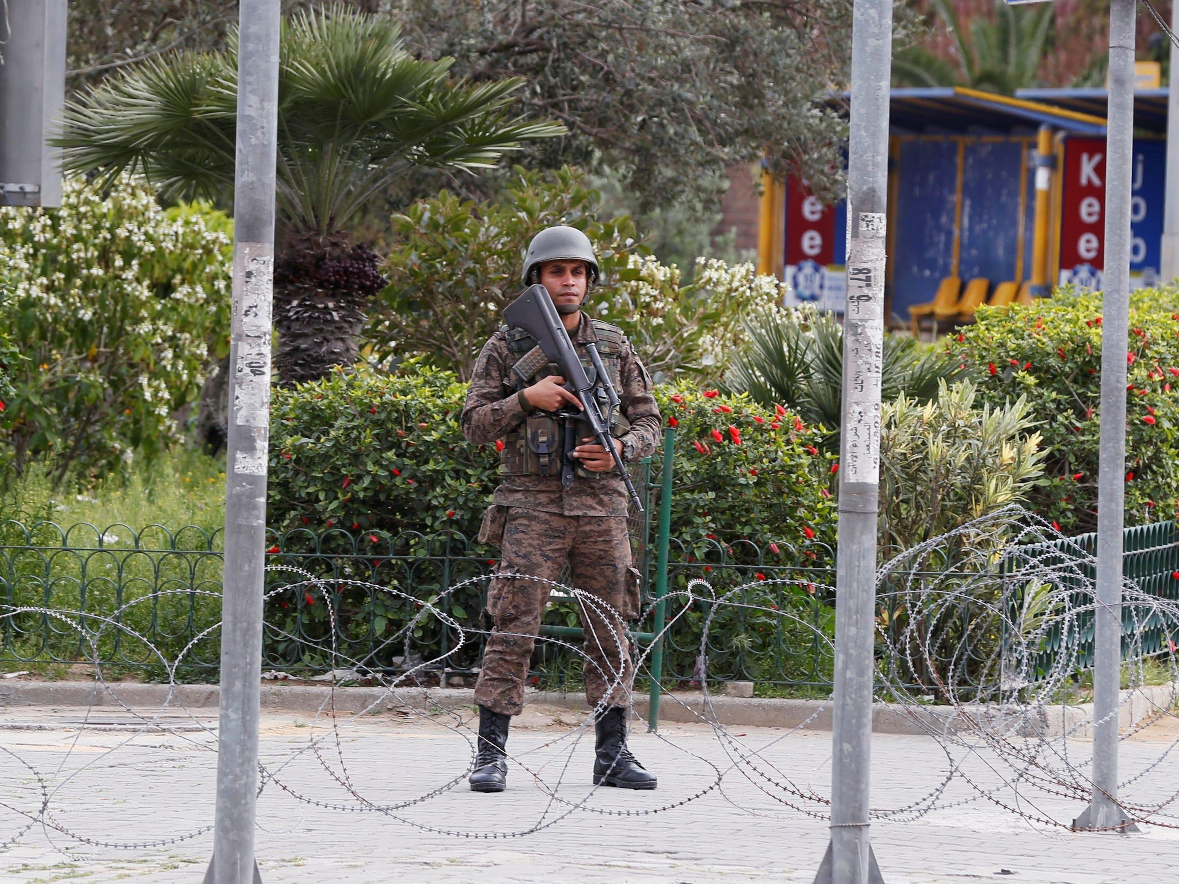 A soldier stands in downtown Tunis on March 24, after Tunisia's president ordered the army to patrol the streets and enforce a public curfew from 6 pm to 6 am to stop the spread of coronavirus.
