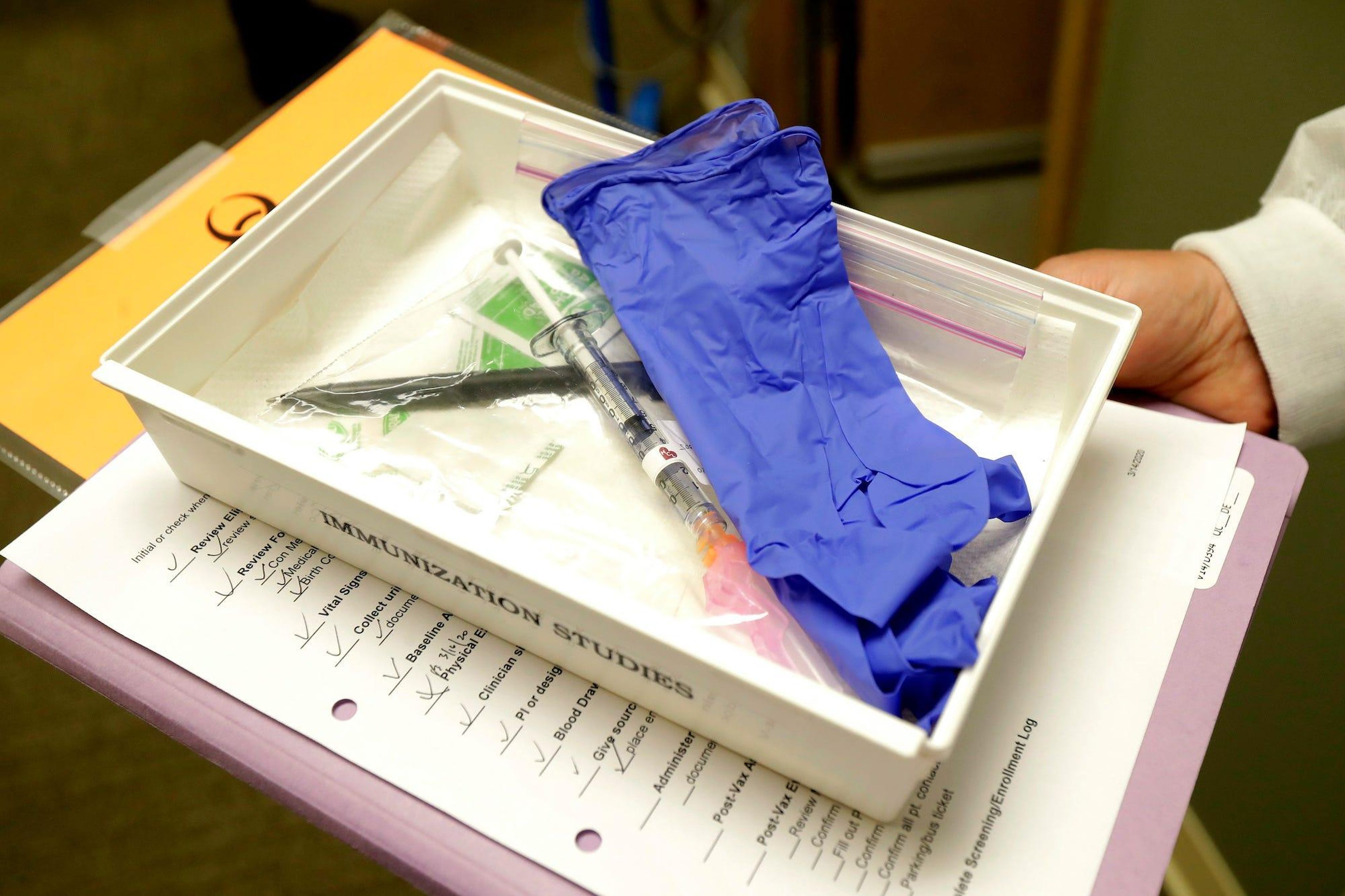 A tray with a syringe containing a shot that will be used in the clinical trial of the COVID-19 vaccine.