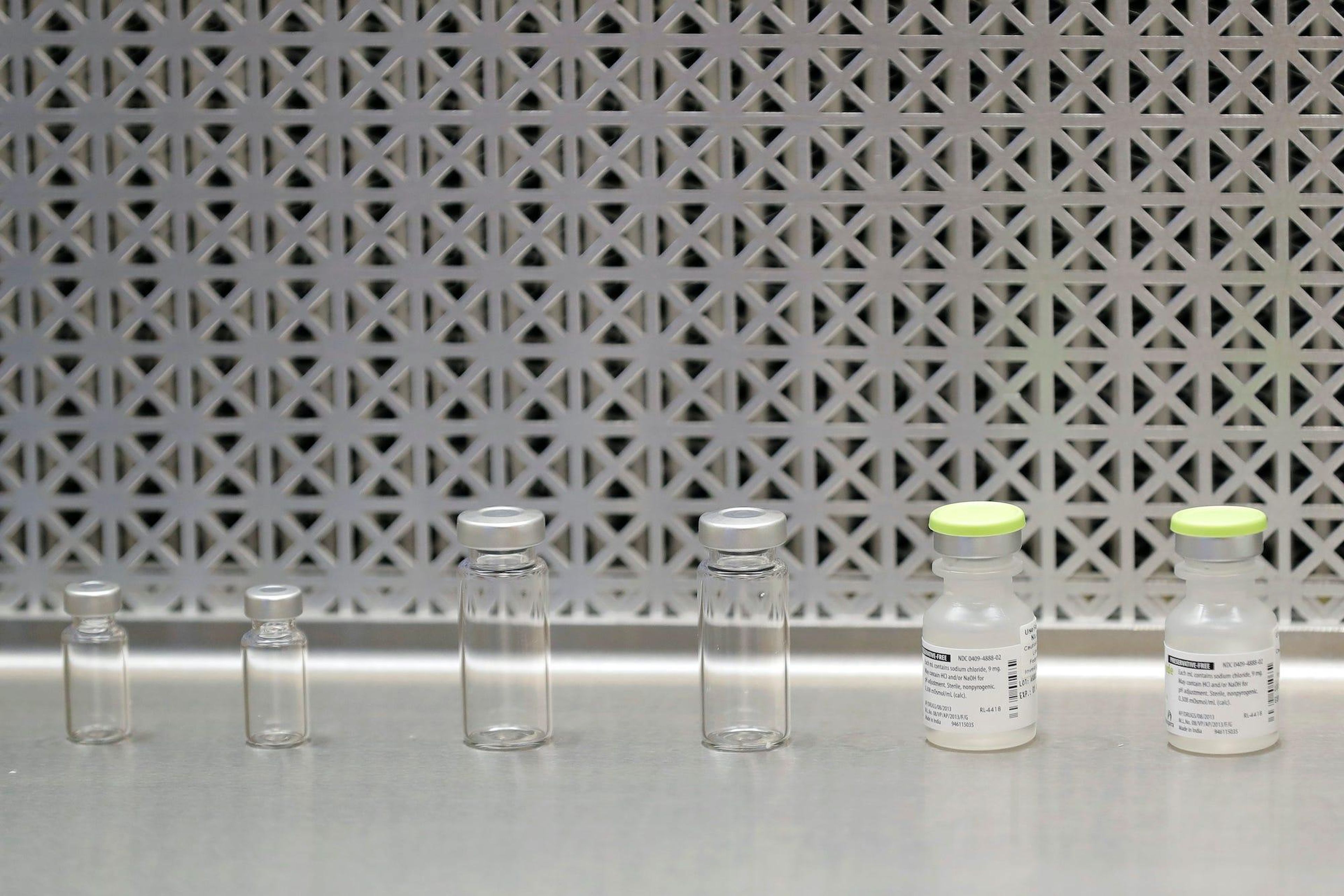 Vials used by pharmacists to prepare syringes used on the first day of a first-stage safety study clinical trial of the potential vaccine for COVID-19.