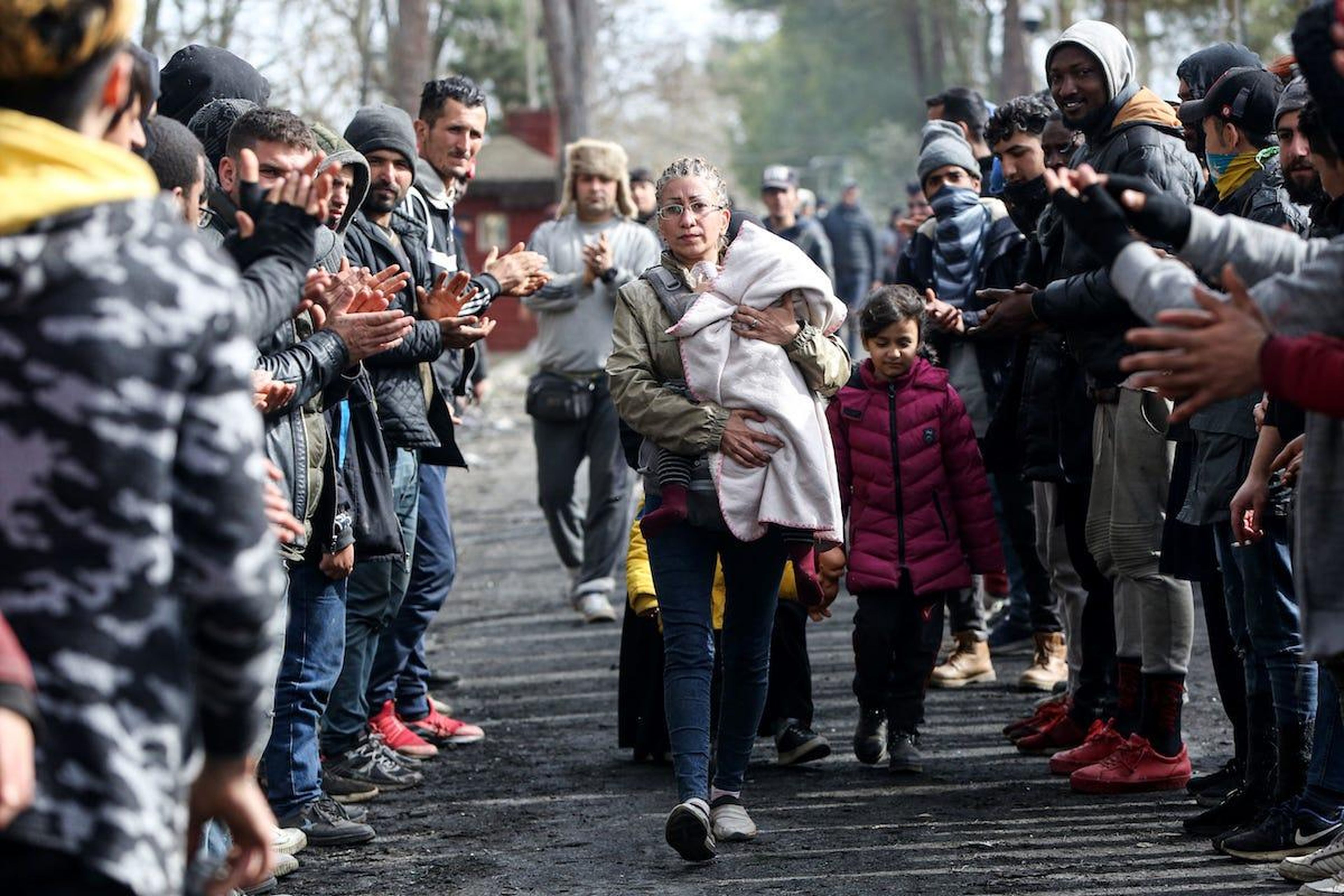 Women Asylum Seekers, waiting at Turkey's Pazarkule border crossing to reach Europe, stage a demonstration at the buffer zone demanding to open the gate during International Women's Day.
