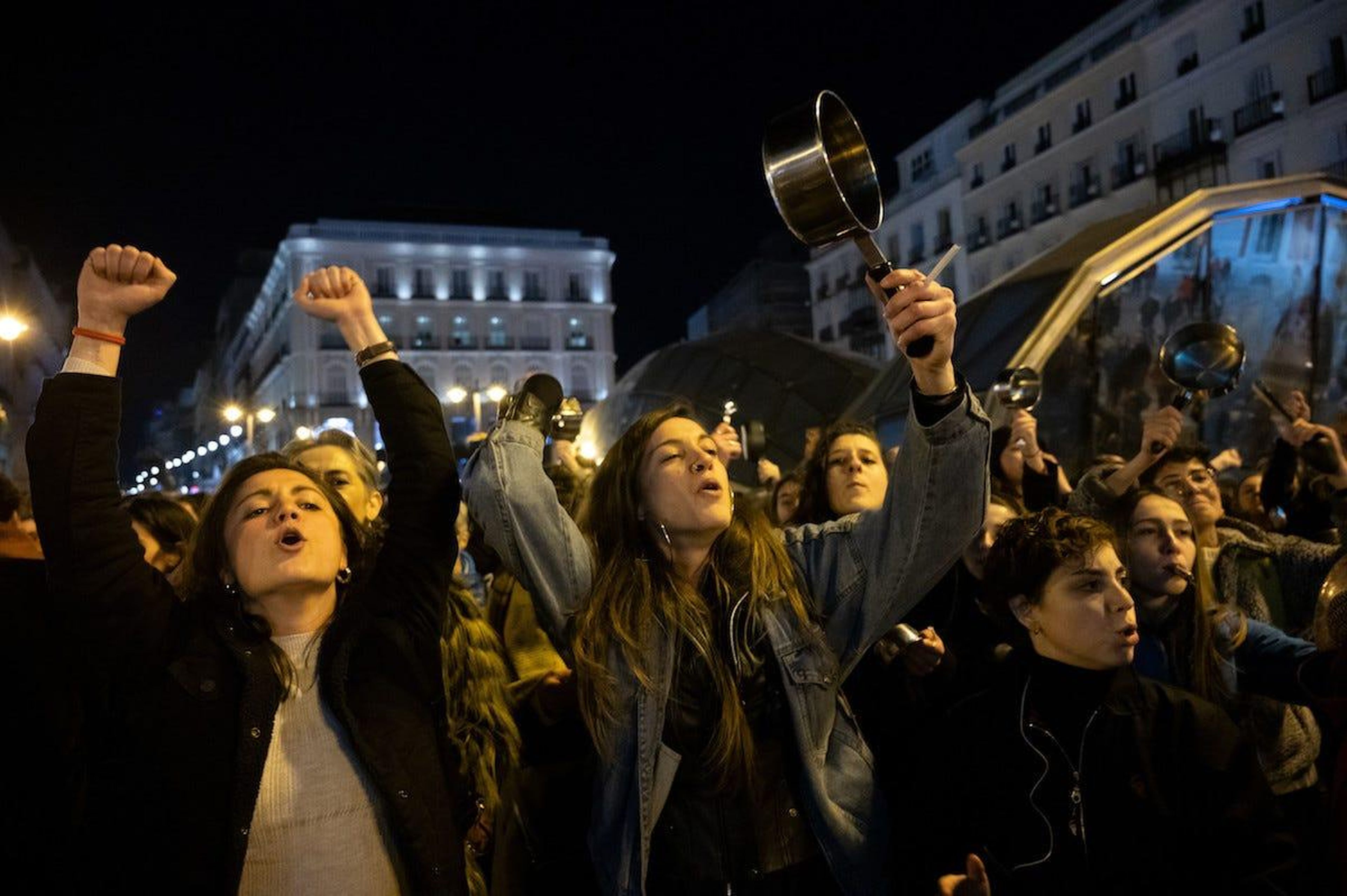 Women bang pots and pans while protesting in Sol Square, Madrid to mark the start of International Women's Day.