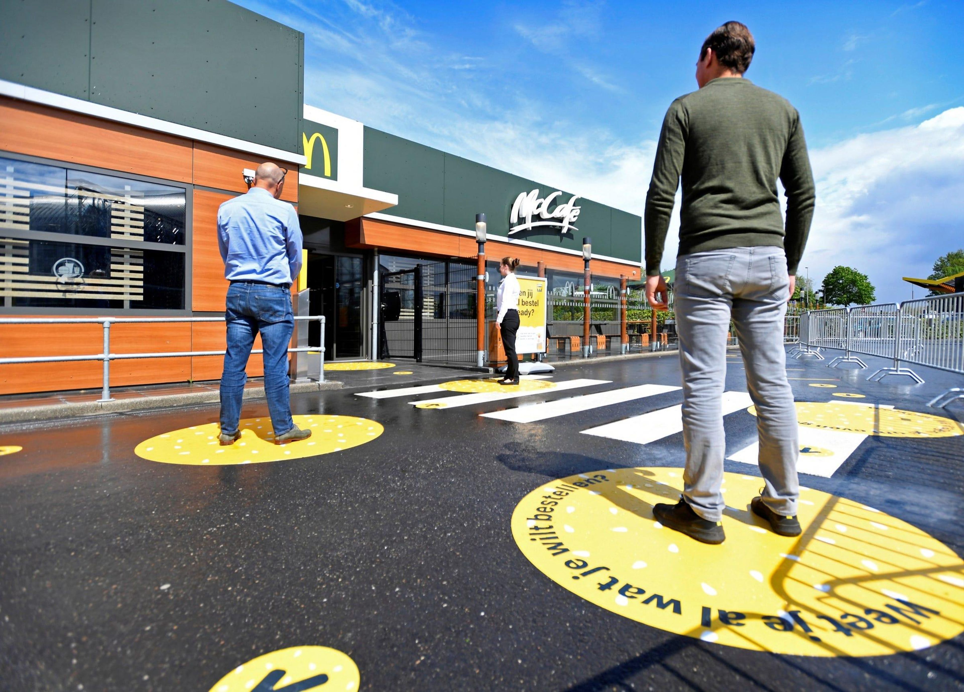 McDonald's is testing decals to promote social distancing among customers.