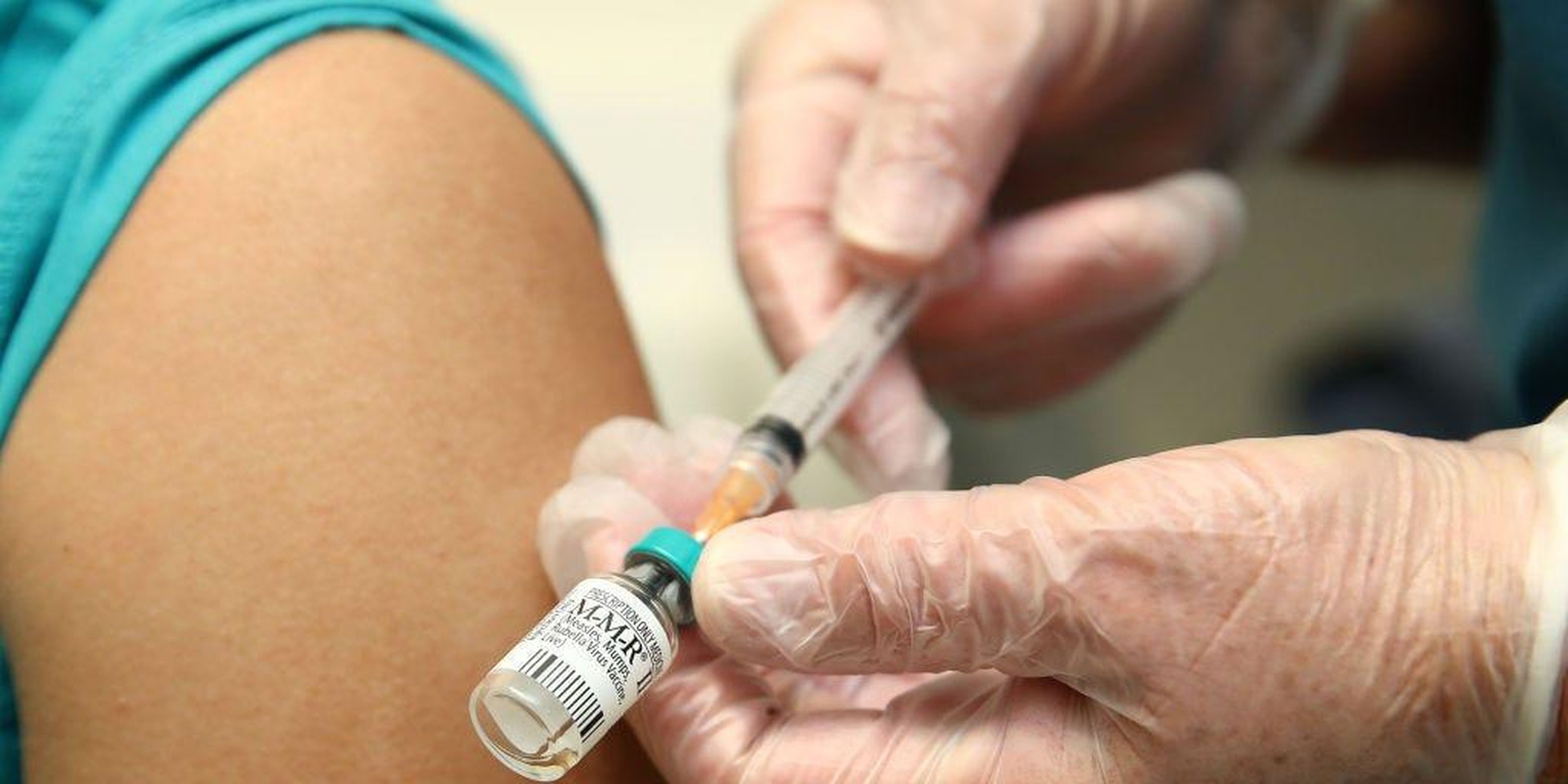 A medical worker preparing a measles vaccine on September 10 in Auckland, New Zealand.