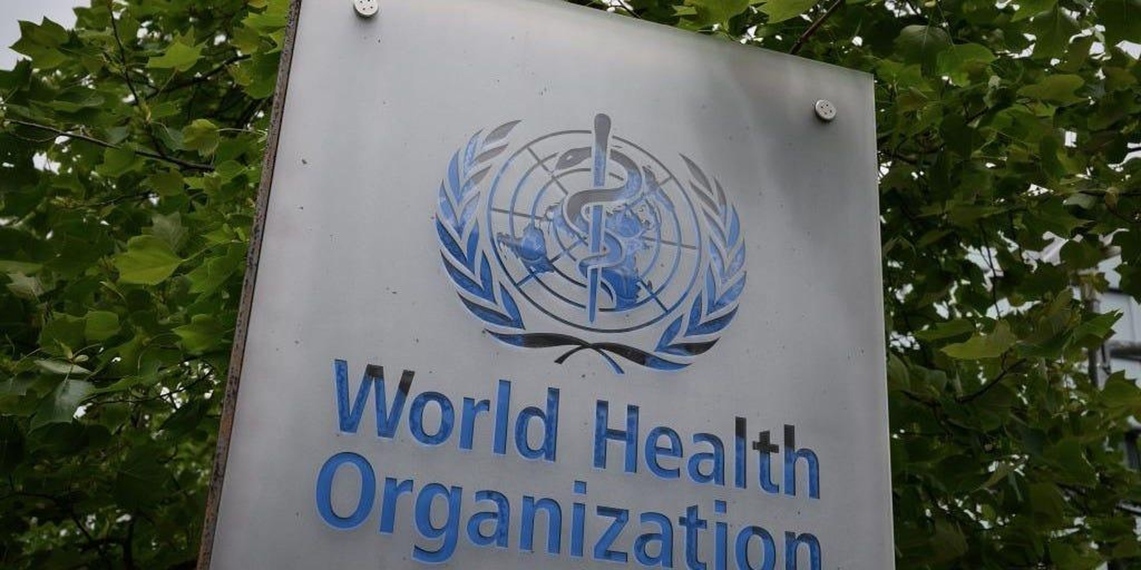 This picture taken on May 12, 2020, shows a sign of the World Health Organization (WHO) in Geneva next to their headquarters, amid the COVID-19 outbreak, caused by the novel coronavirus.