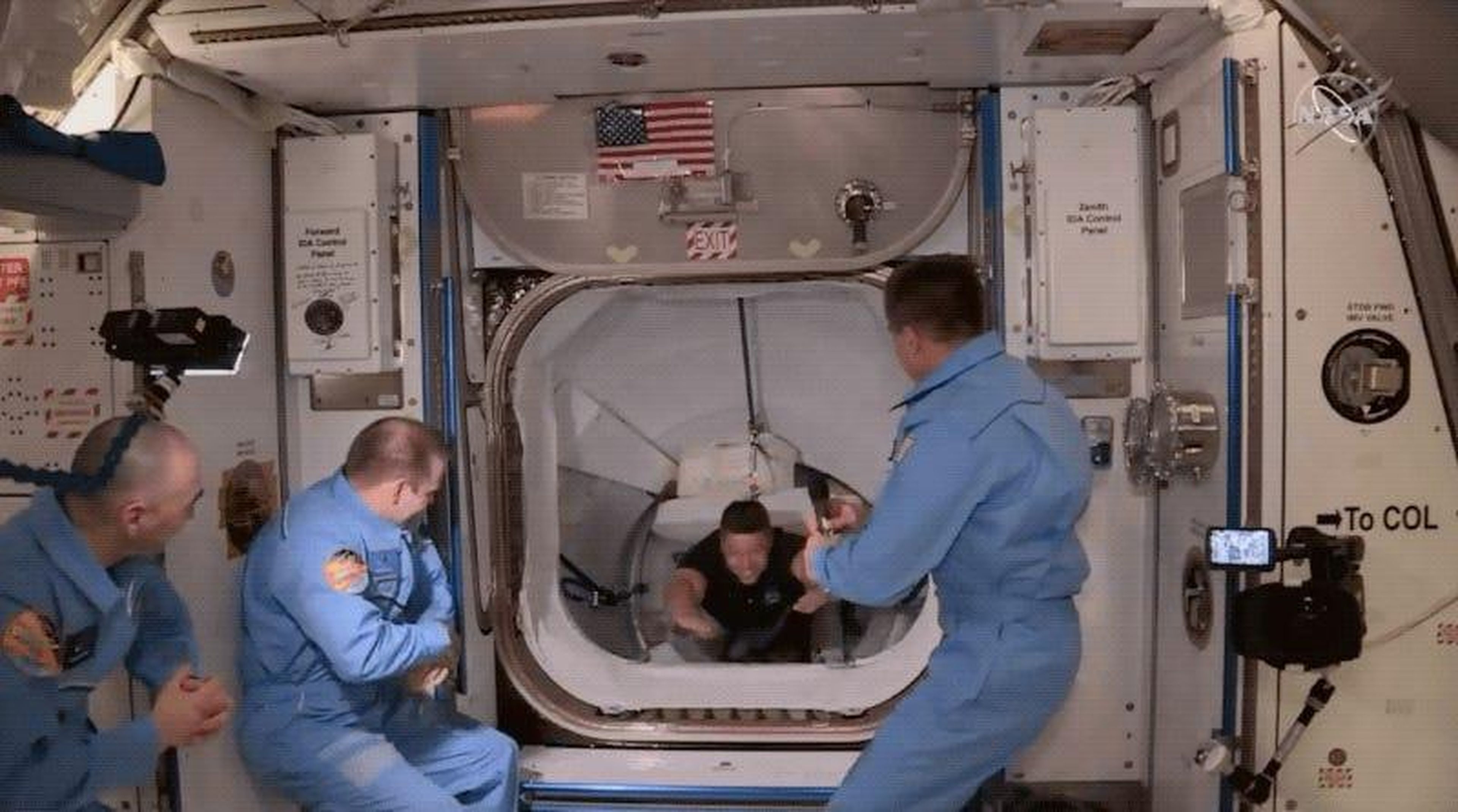 NASA astronauts Bob Behnken and Doug Hurley float into the International Space Station on May 31, 2020, after riding SpaceX's Crew Dragon spaceship to the orbiting laboratory.