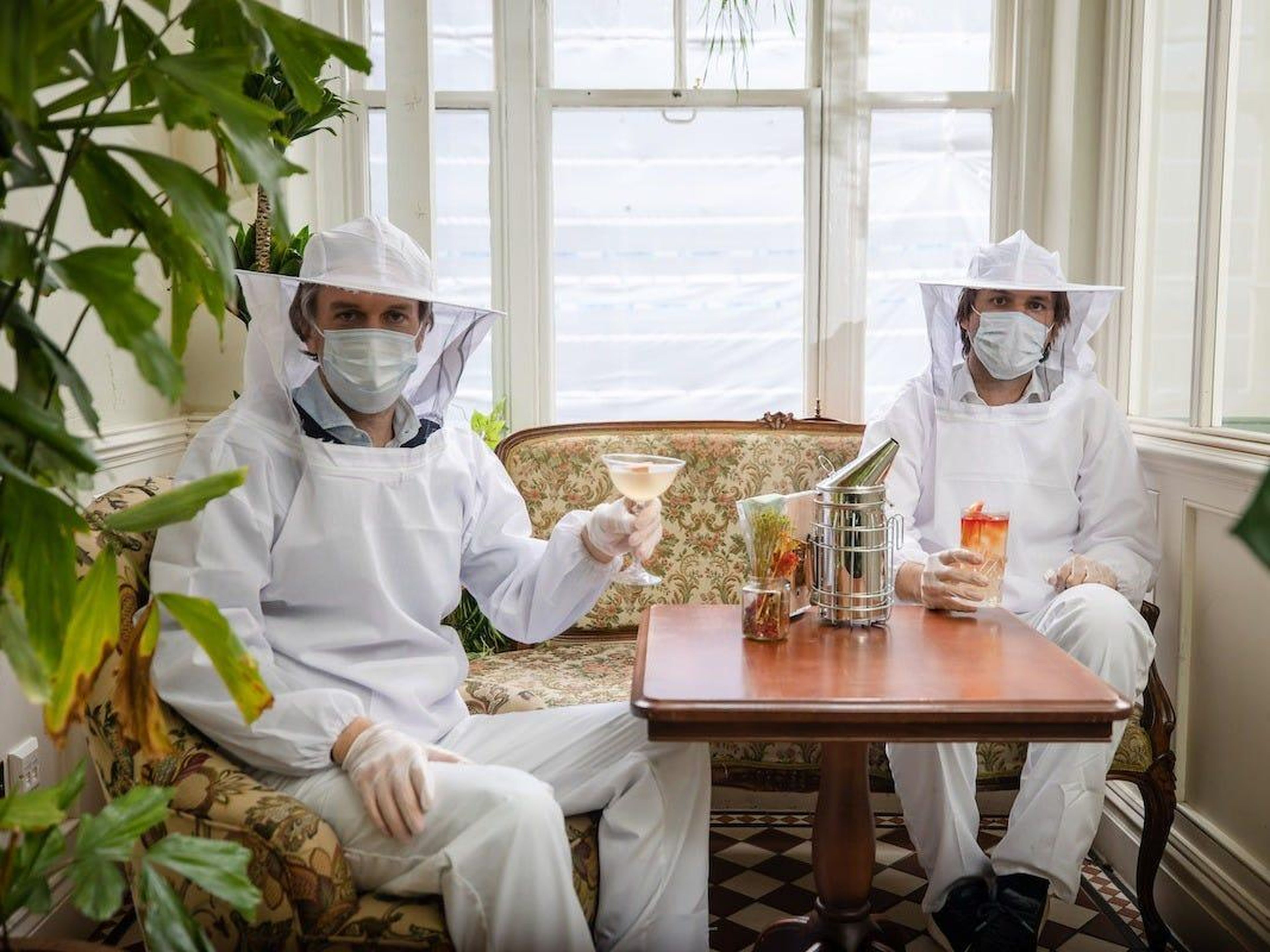 Co-founders Charlie Gilkes and Duncan Stirling wear the beekeeping suits.