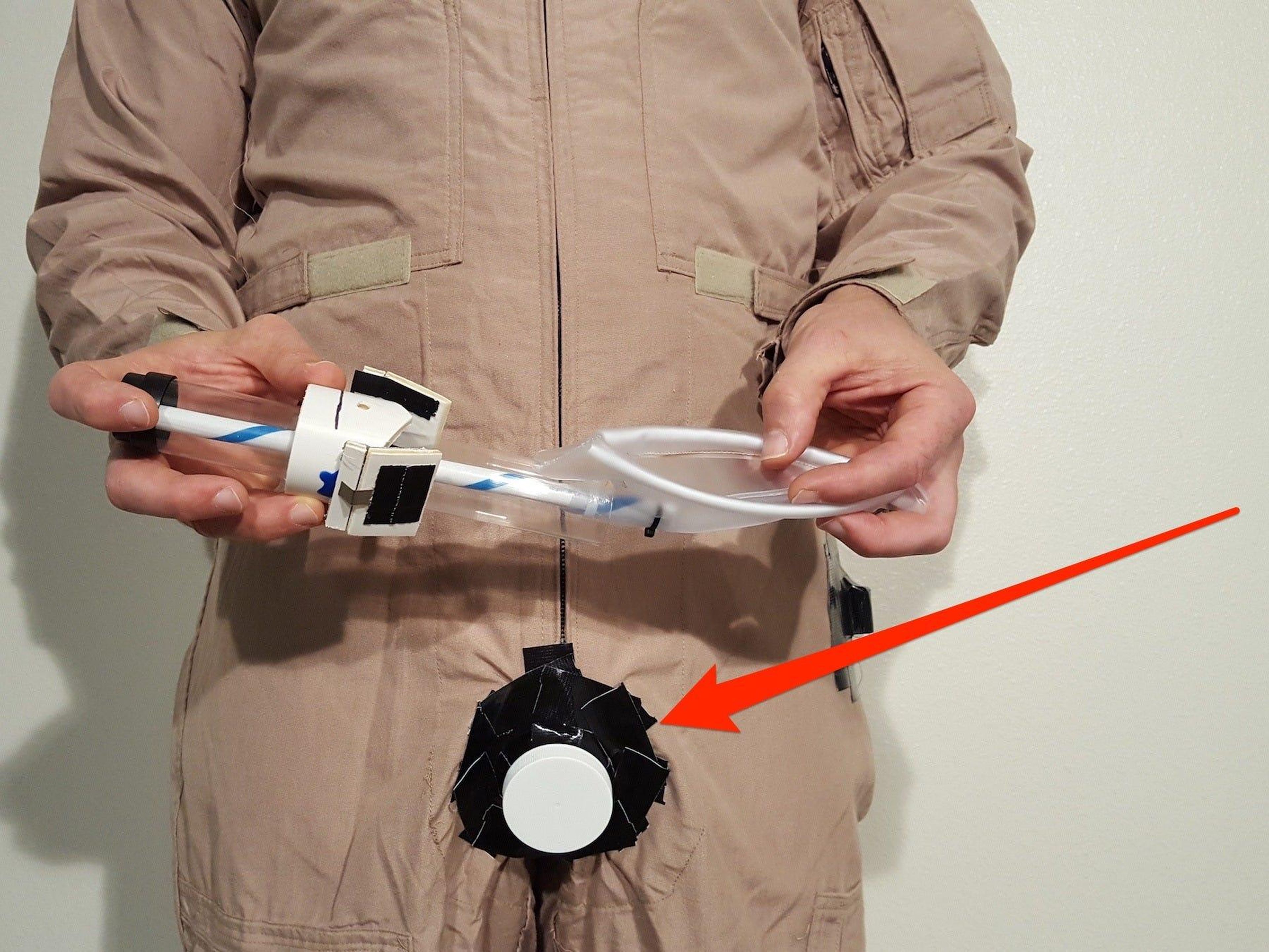 Dr. Thatcher Cardon's system hinges on an air-lock port that astronauts could use to slip items like inflatable bedpans and space underwear in and out of their suits without depressurizing them. Courtesy Dr. Thatcher Cardon; Business Insider