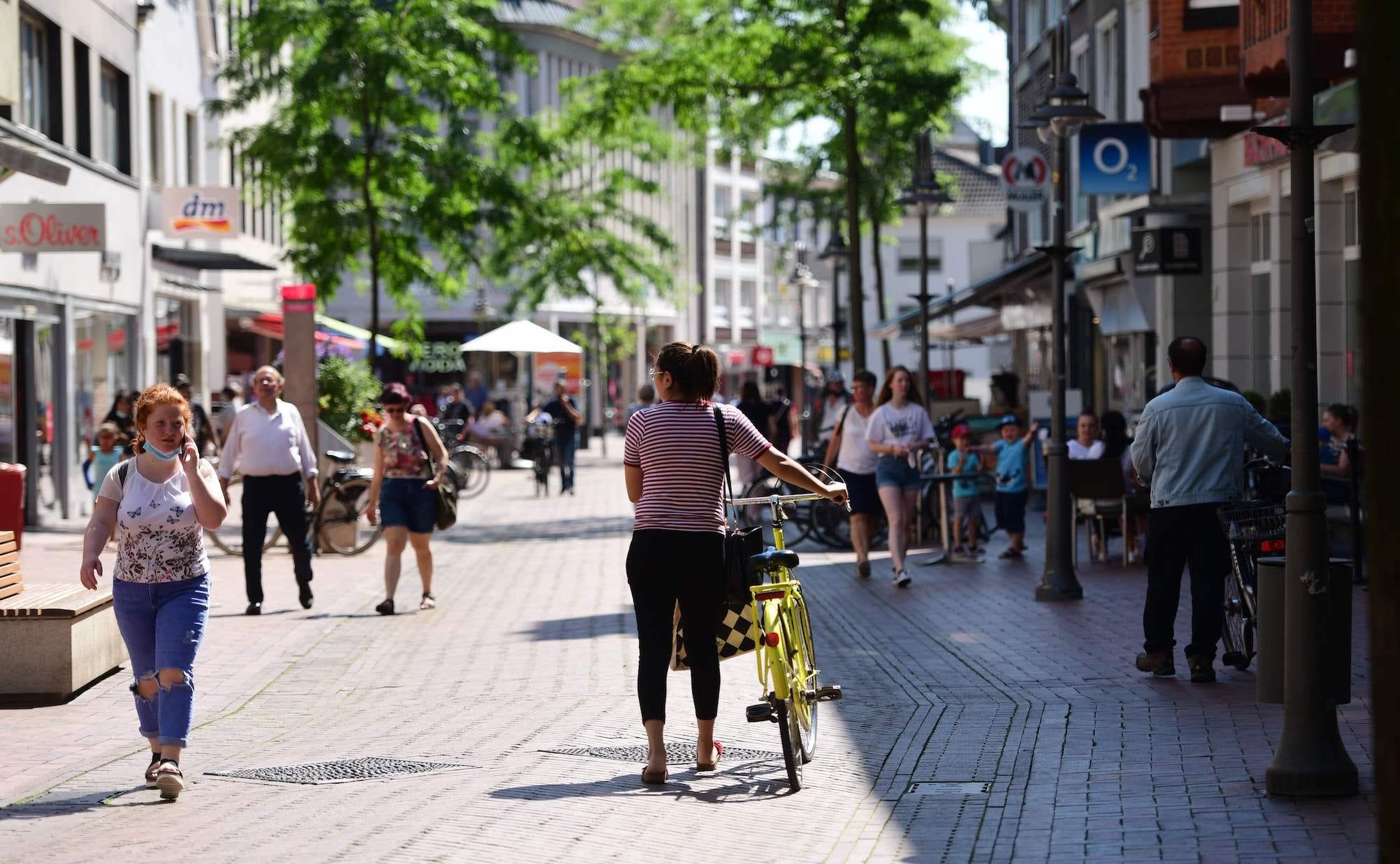 Citizens walk at the pedestrian zone in Guetersloh, western Germany on June 23, 2020.