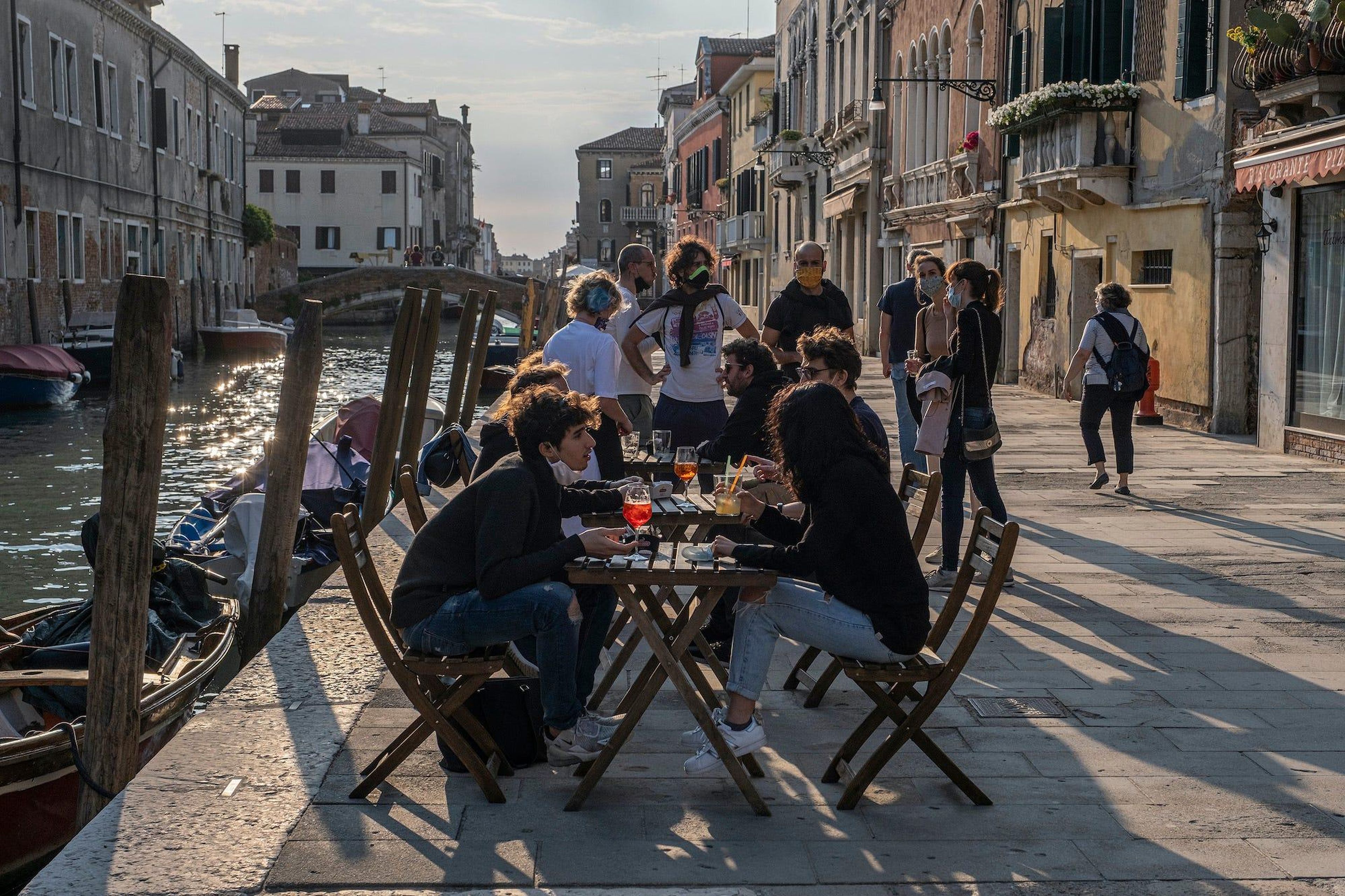 Venetians drink the aperitif in a bar on May 20, 2020 in Venice, Italy.