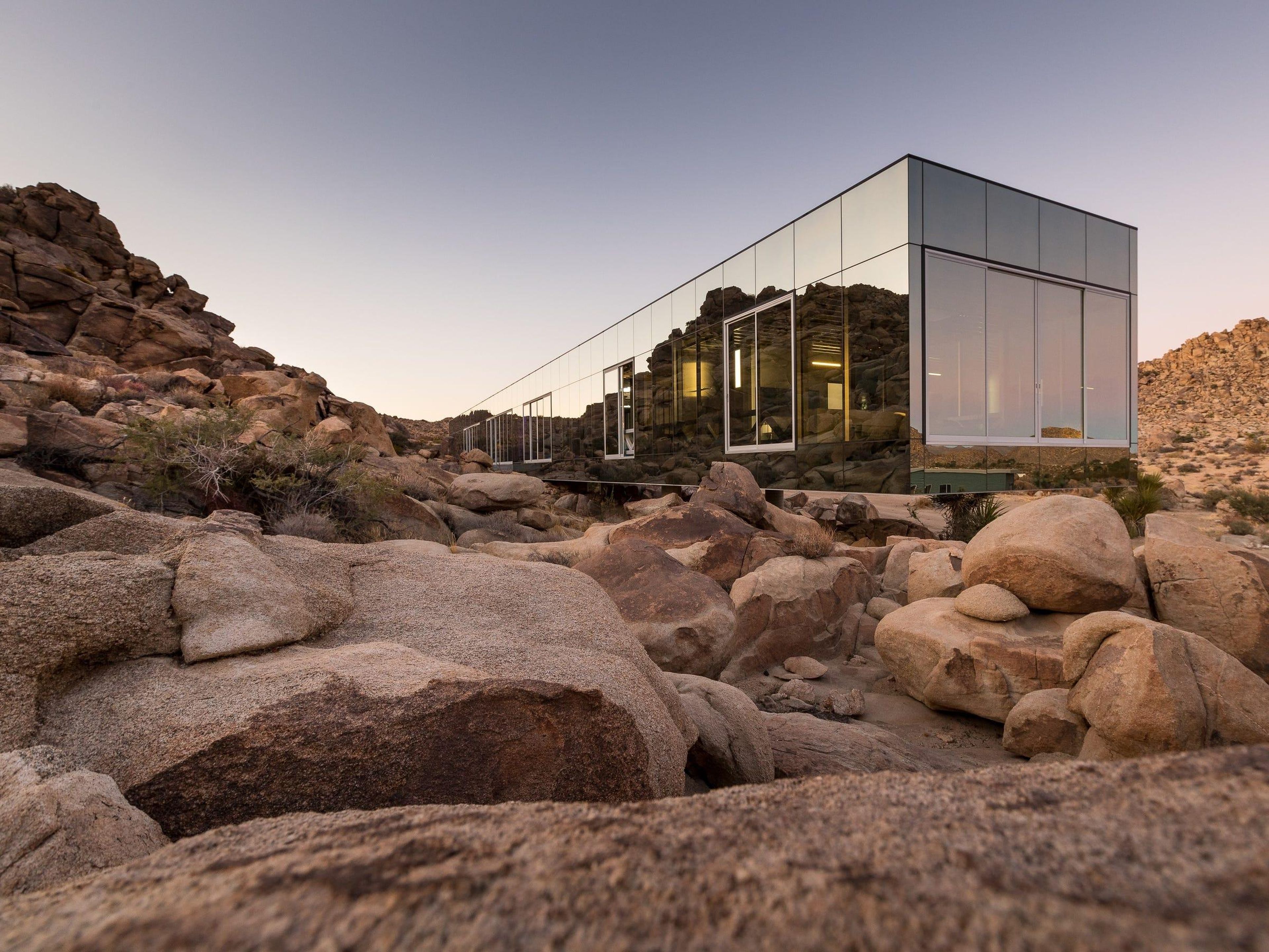 Located on 90 private acres bordering Joshua Tree National Park, it blends in with the surrounding desert thanks to its mirrored glass exterior.