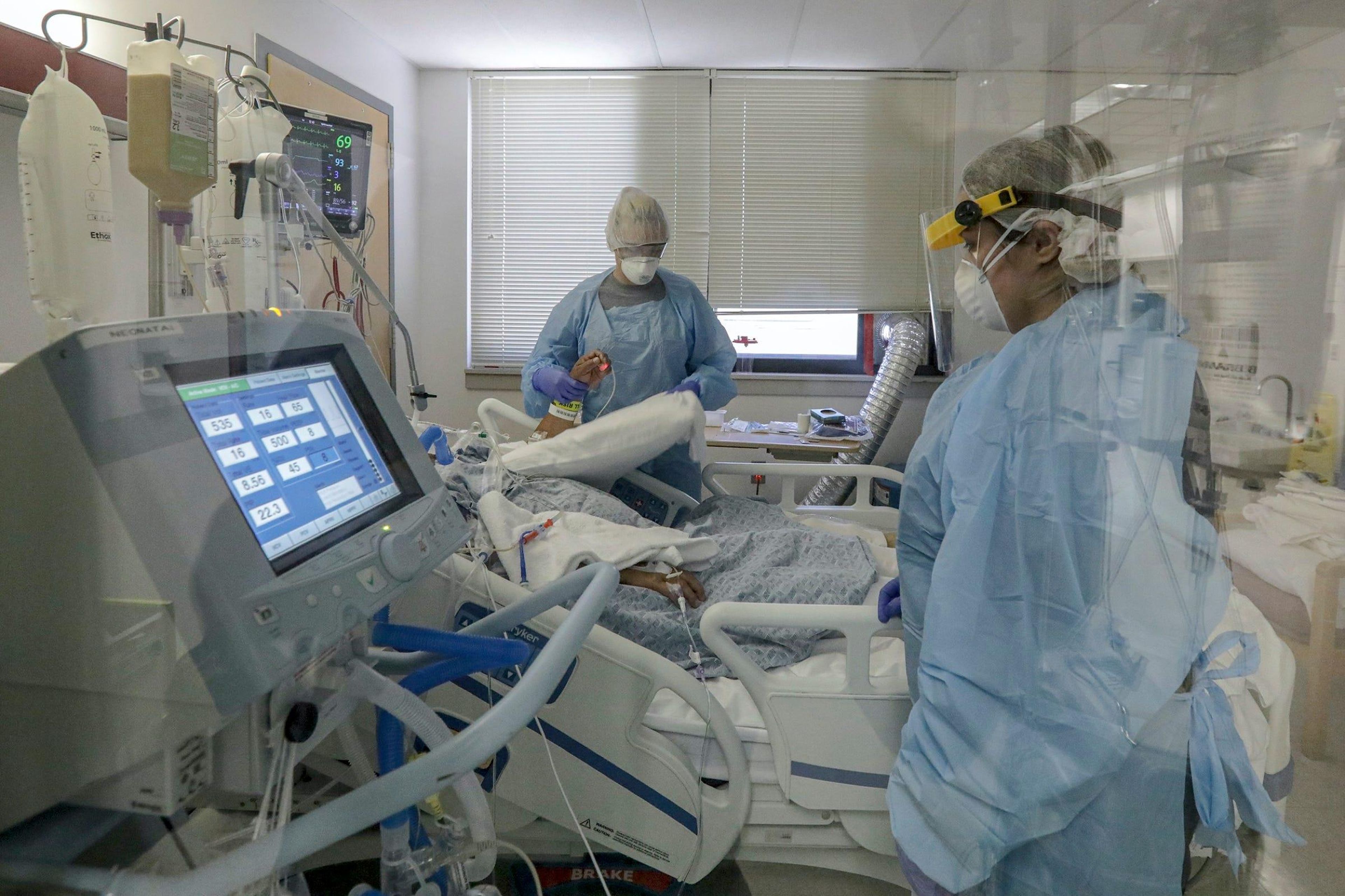 Nurses attend to a COVID-19 patient on ventilator at Desert Valley Medical Group. Victorville, CA.