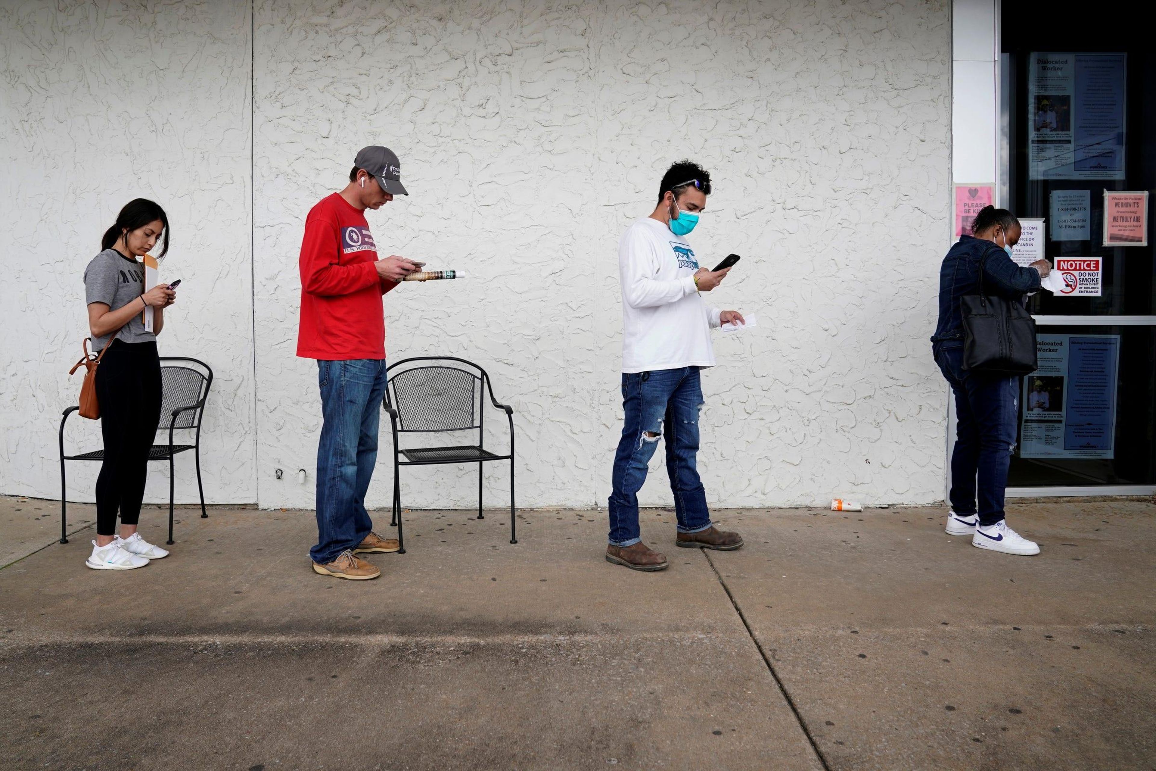 People wait in line to file for unemployment at an Arkansas Workforce Center in Fayetteville, Arkansas, on April 6, 2020. Nick Oxford/Reuters