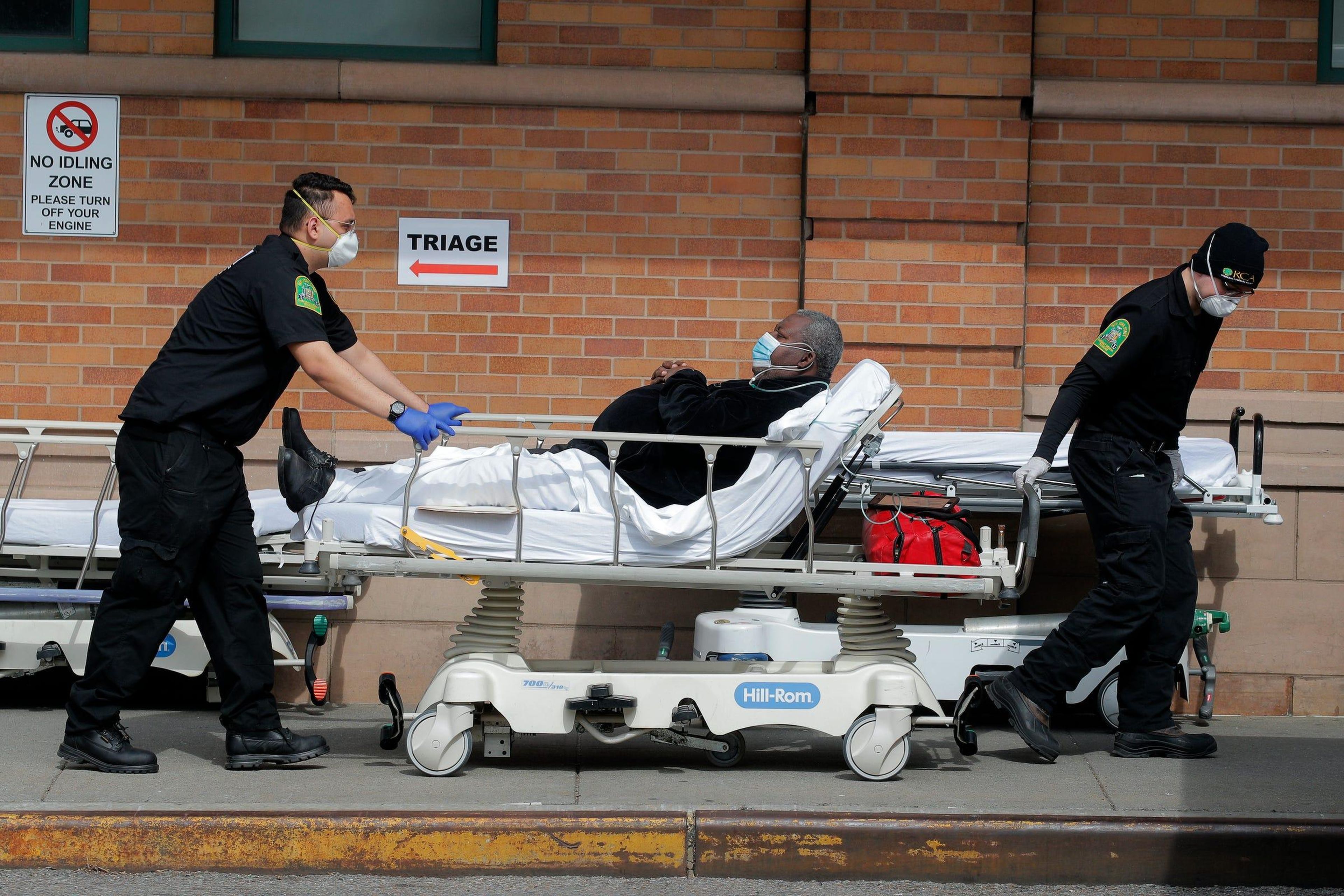 Paramedics take a patient to a Brooklyn emergency room during the coronavirus outbreak in New York on April 7, 2020. Brendan Mcdermid/Reuters