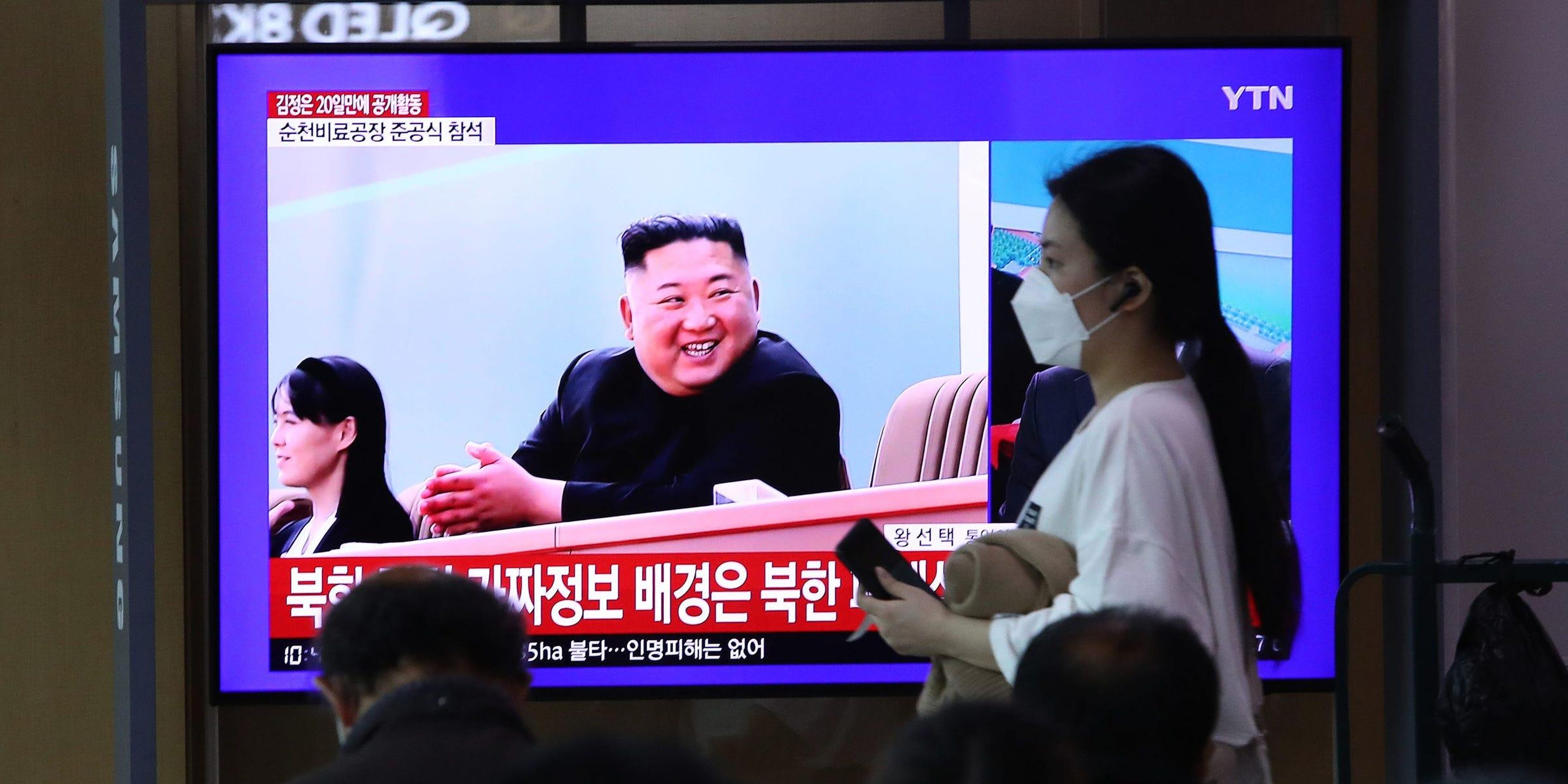 People watch a television broadcast reporting an image of North Korean leader Kim Jong Un on May 2, 2020. Chung Sung-Jun/Getty Images