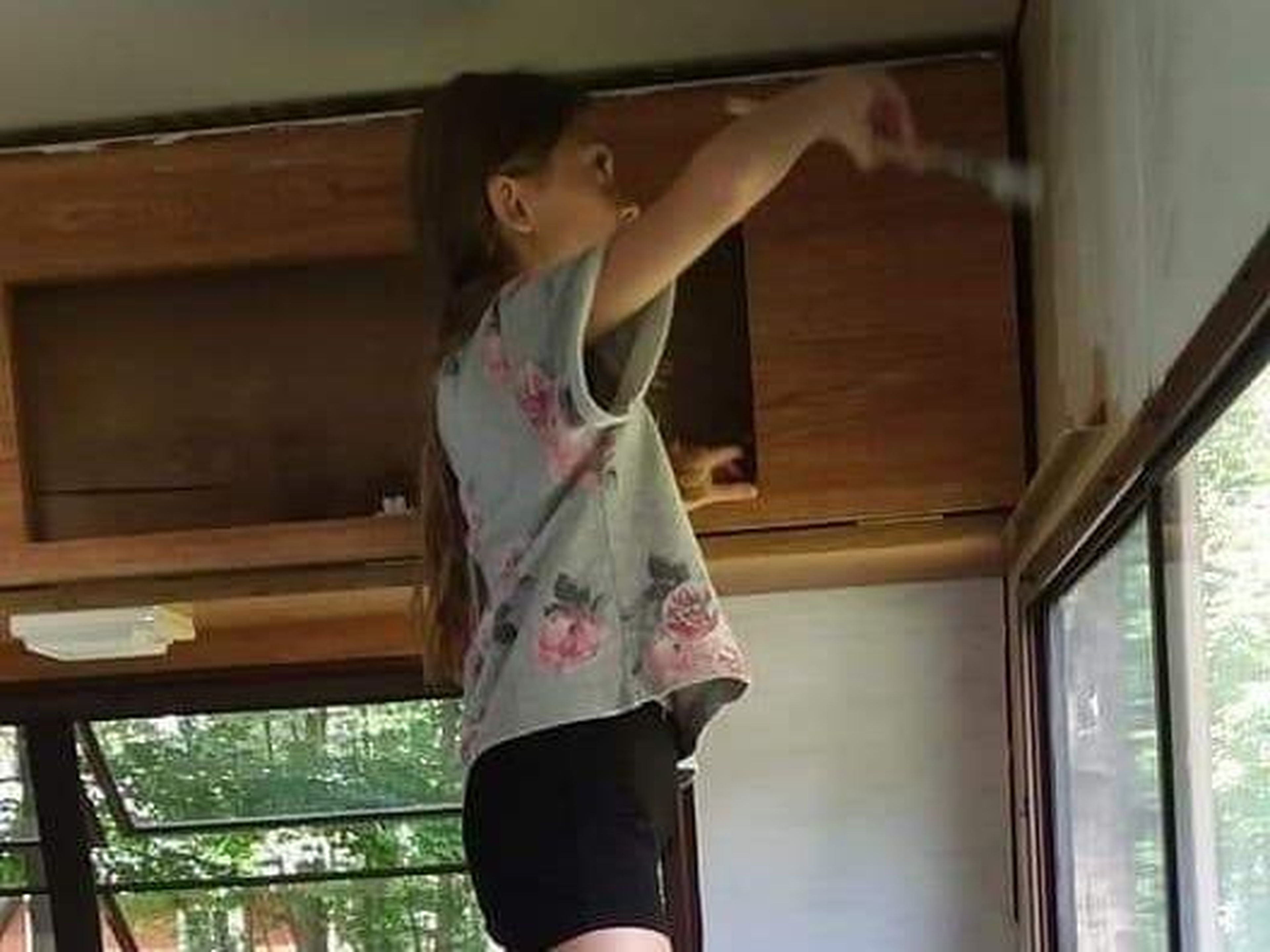 Lauren painting the camper. Courtesy of Aimee Nelson