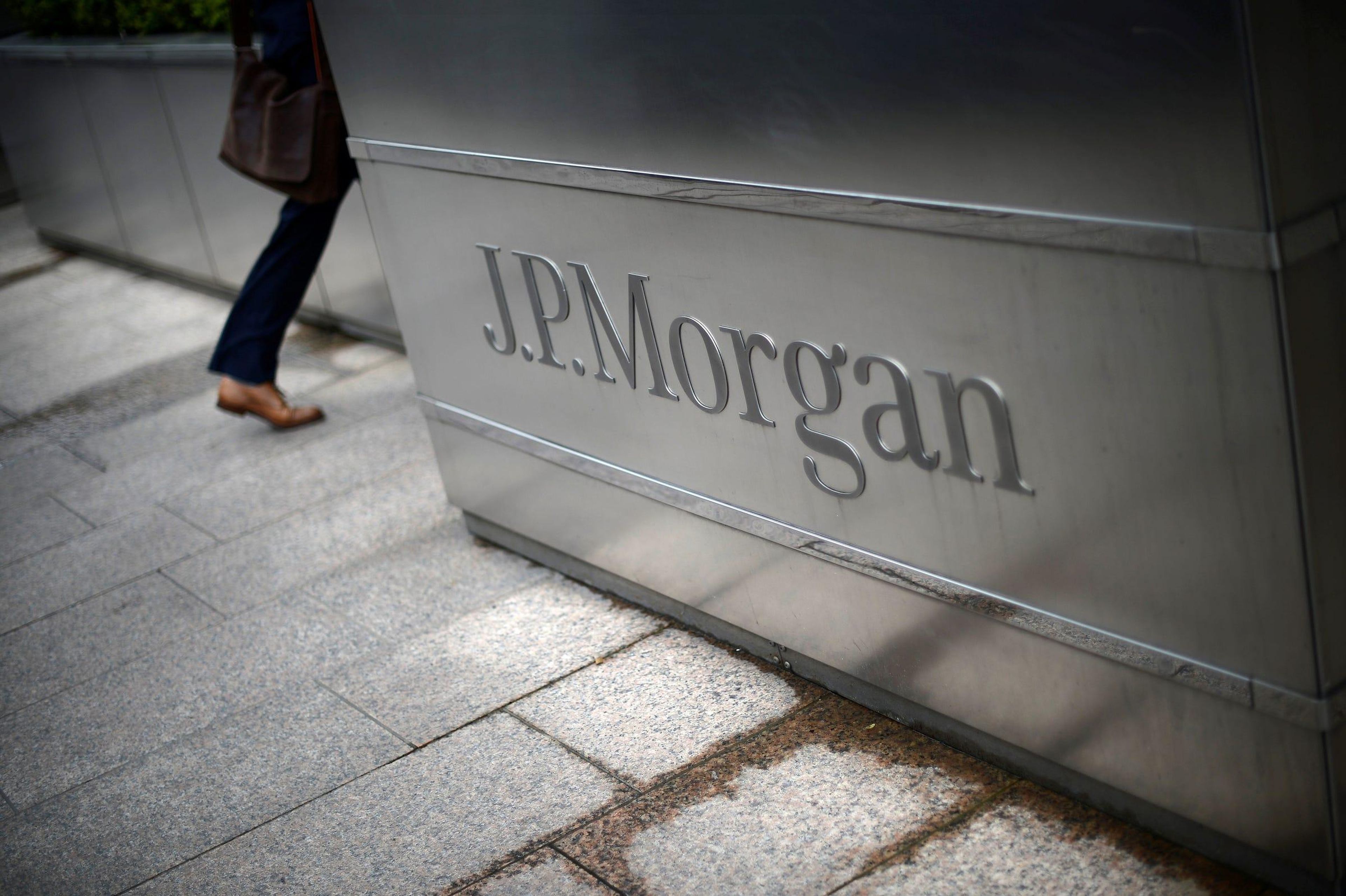 A man walks into the JP Morgan headquarters at Canary Wharf in London. Reuters