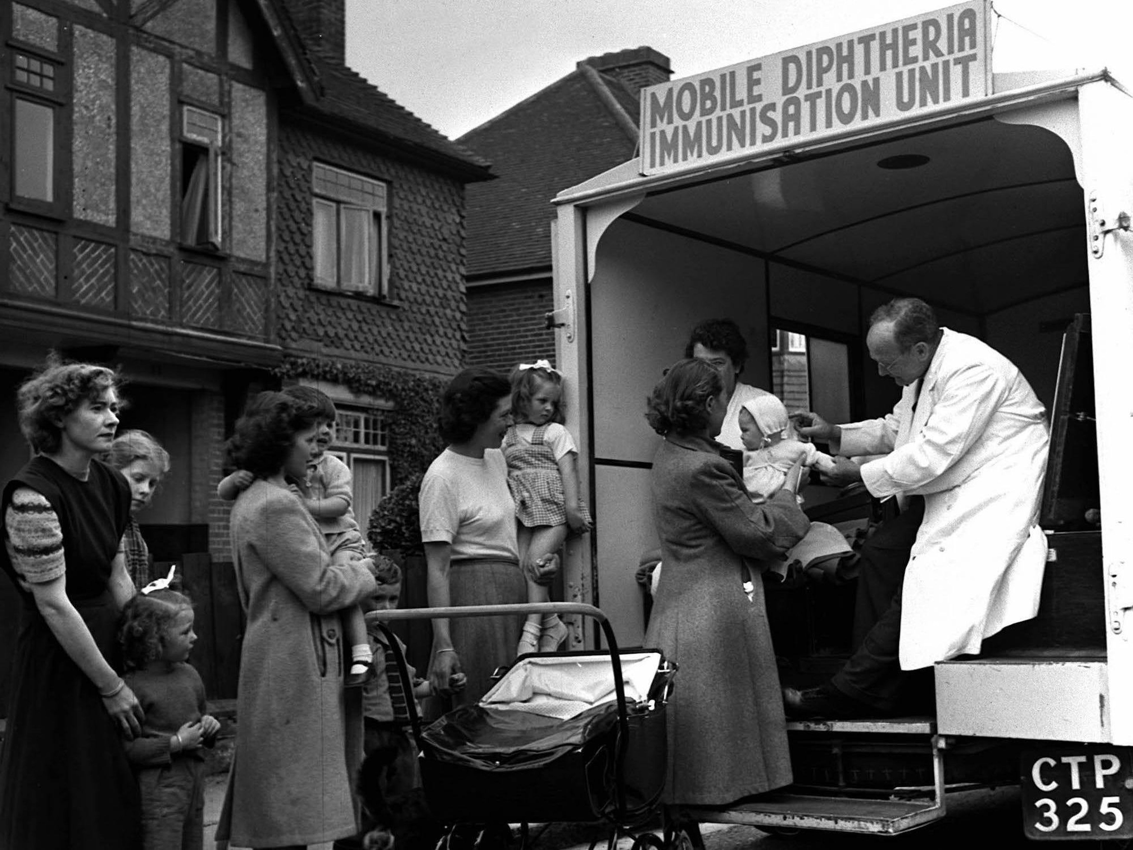 The UK National Health Service at work in Portsmouth, where mobile immunization vans like this one helped reduced the risk of diphtheria cases from 776 twenty years prior to 1 in 1950. Doctors gave more than 37,000 various injections.