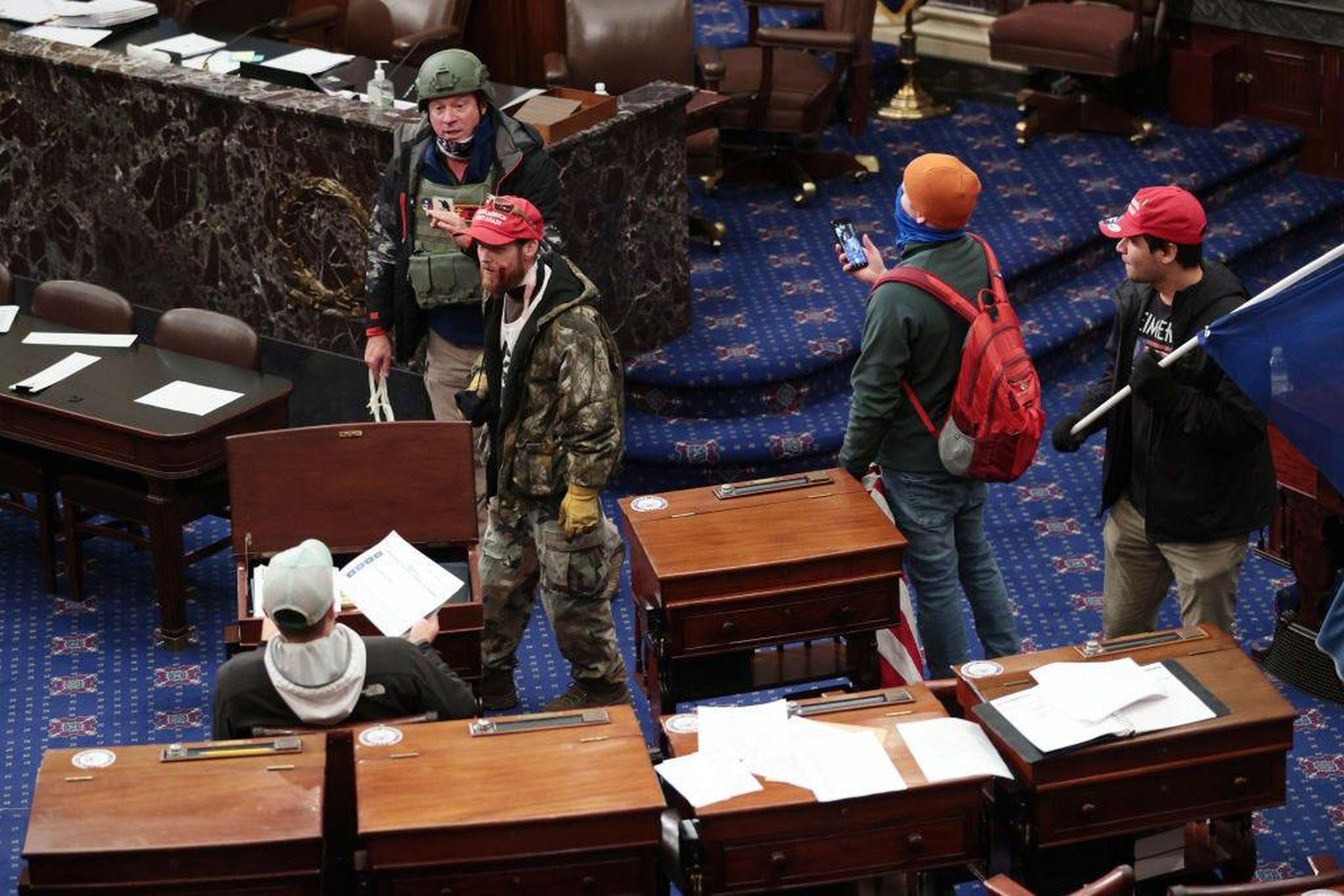 Protesters enter the Senate Chamber.