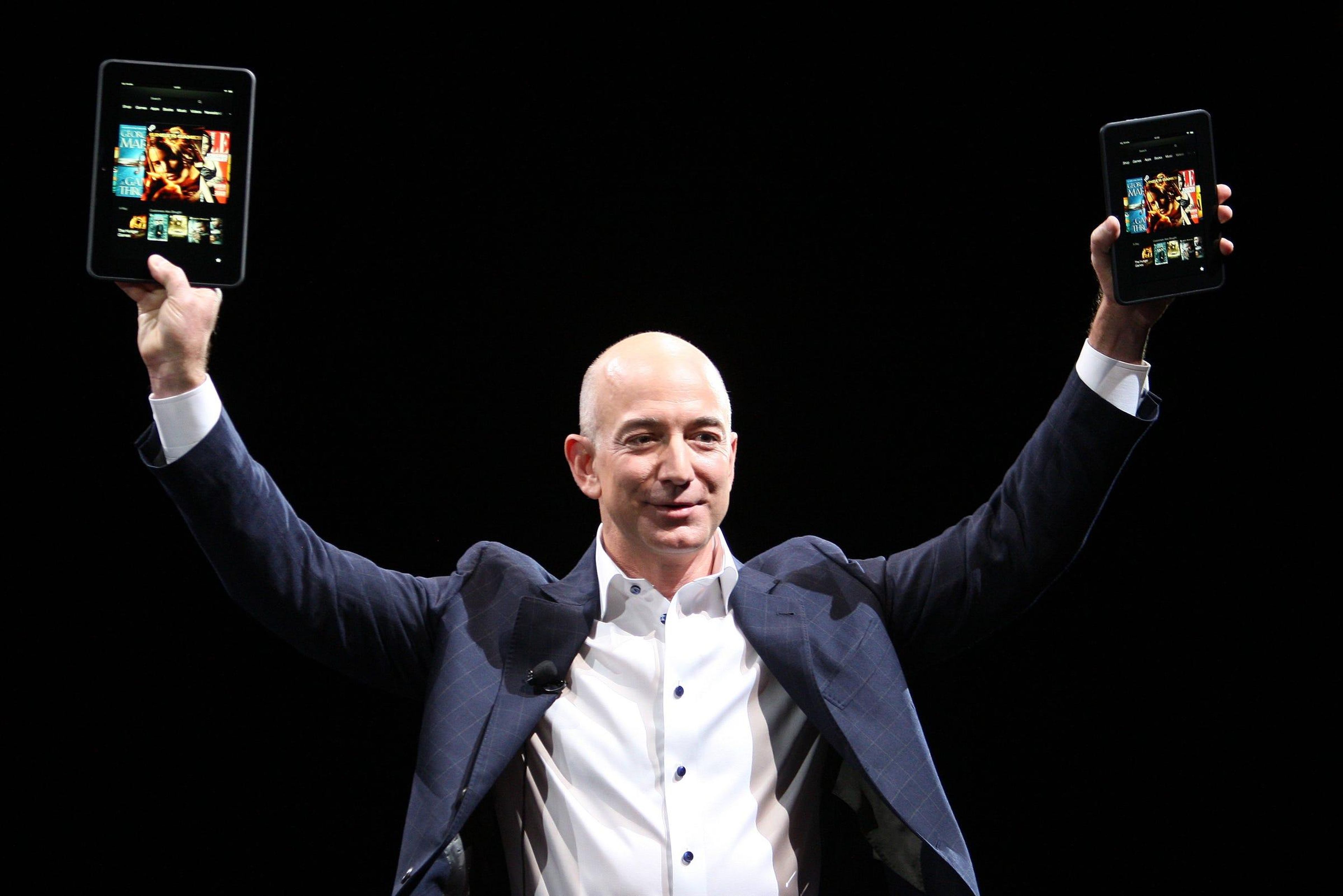 Amazon CEO Jeff Bezos holds two Kindle Fire HD devices during a press conference on September 6, 2012 in Santa Monica, California.