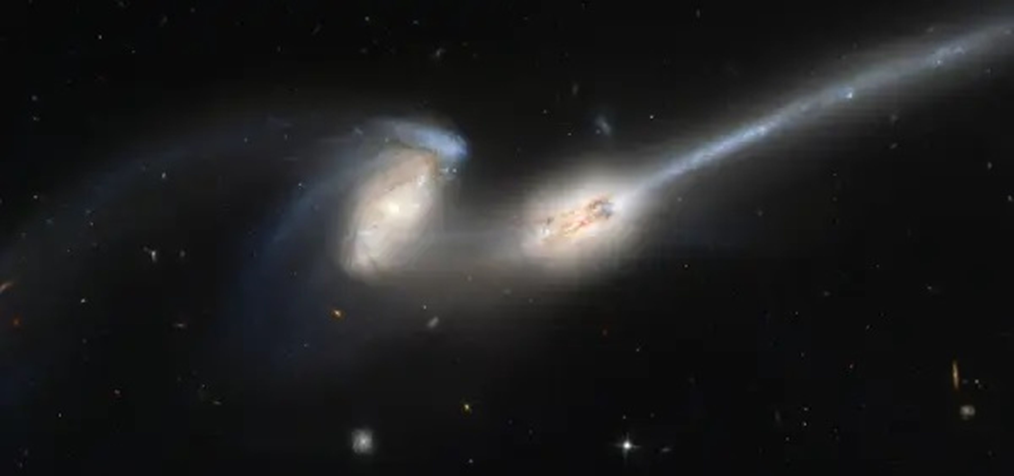 Hubble Space Telescope captured a galaxy collision known as "The Mice" because of the long tails of stars and gas emanating from each galaxy.